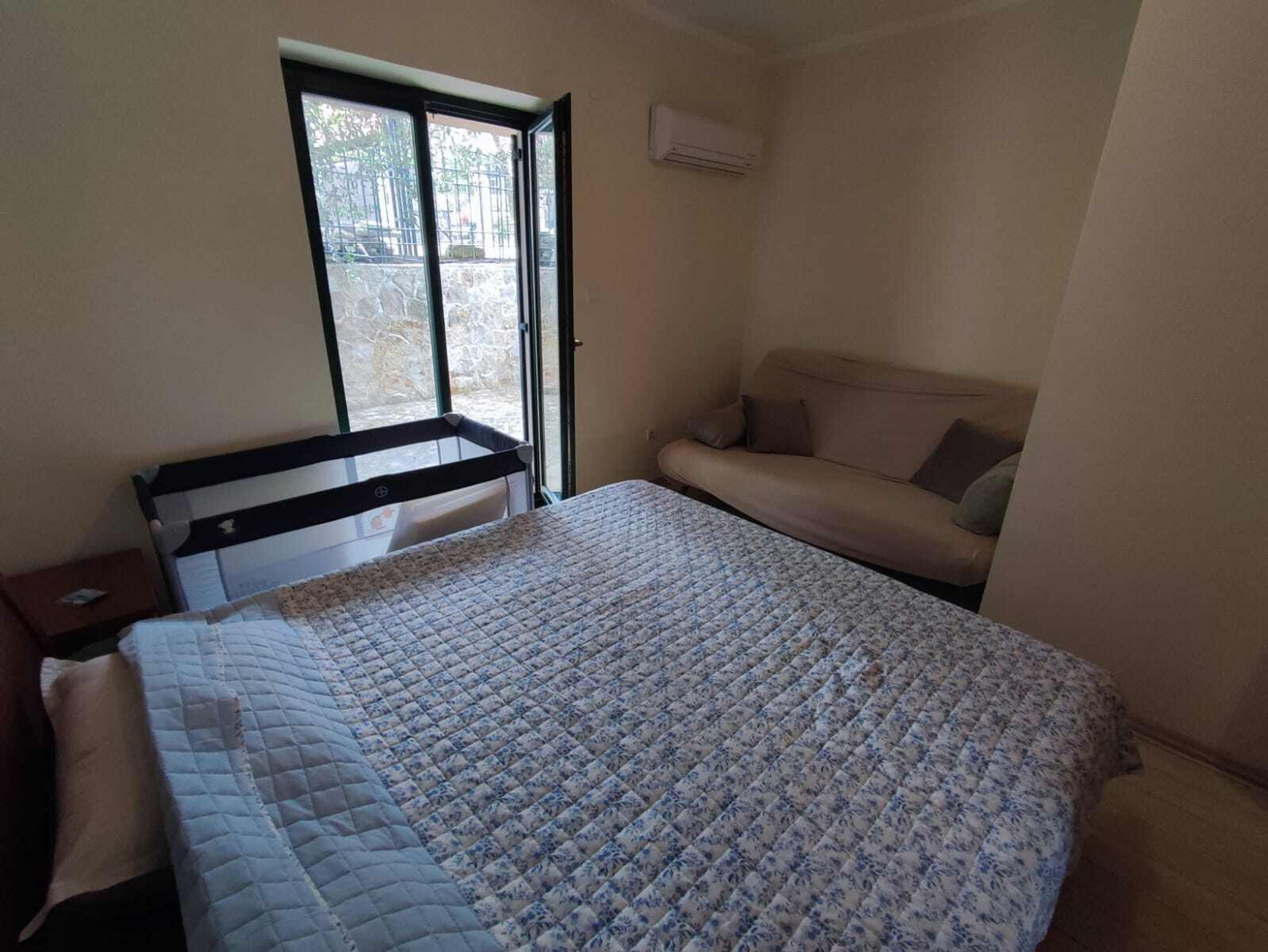 Bedroom with bed and sofa