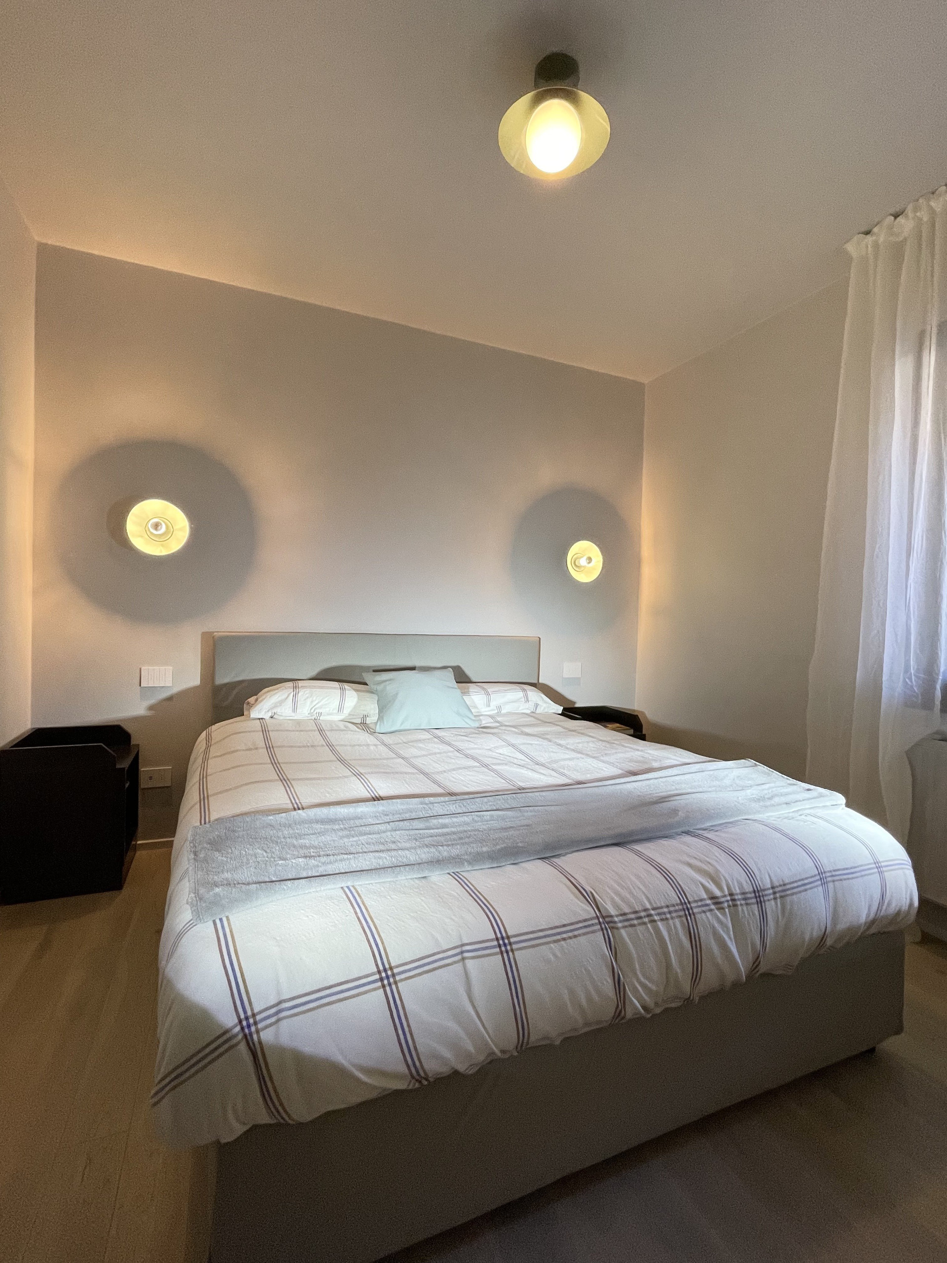 Master bedroom with dual wall lights