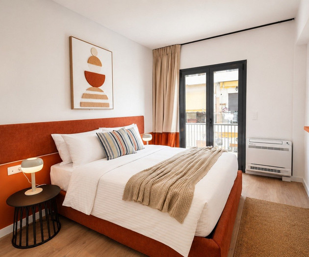 Bedroom with TV and balcony