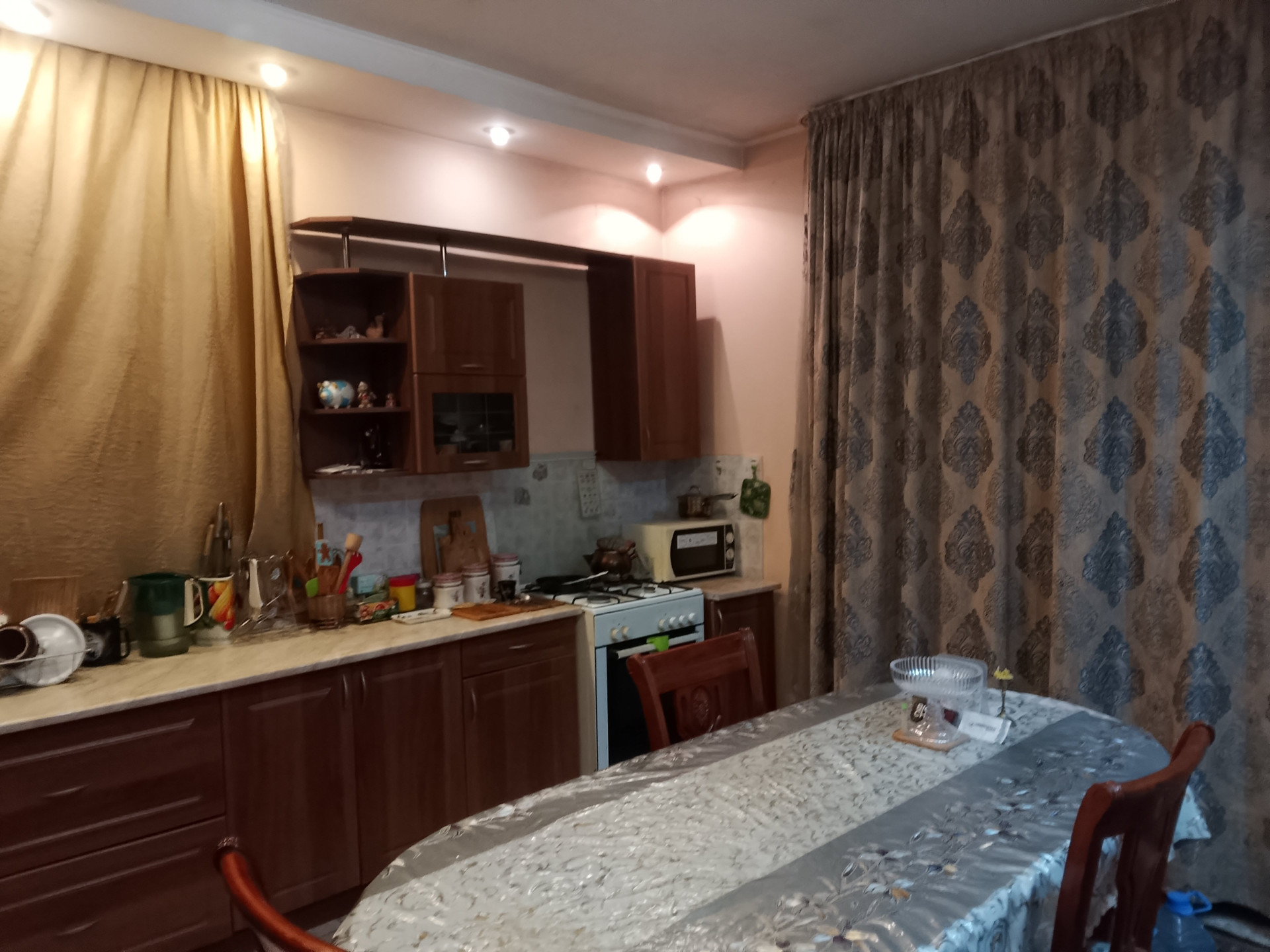 Kitchen with dining table and curtains