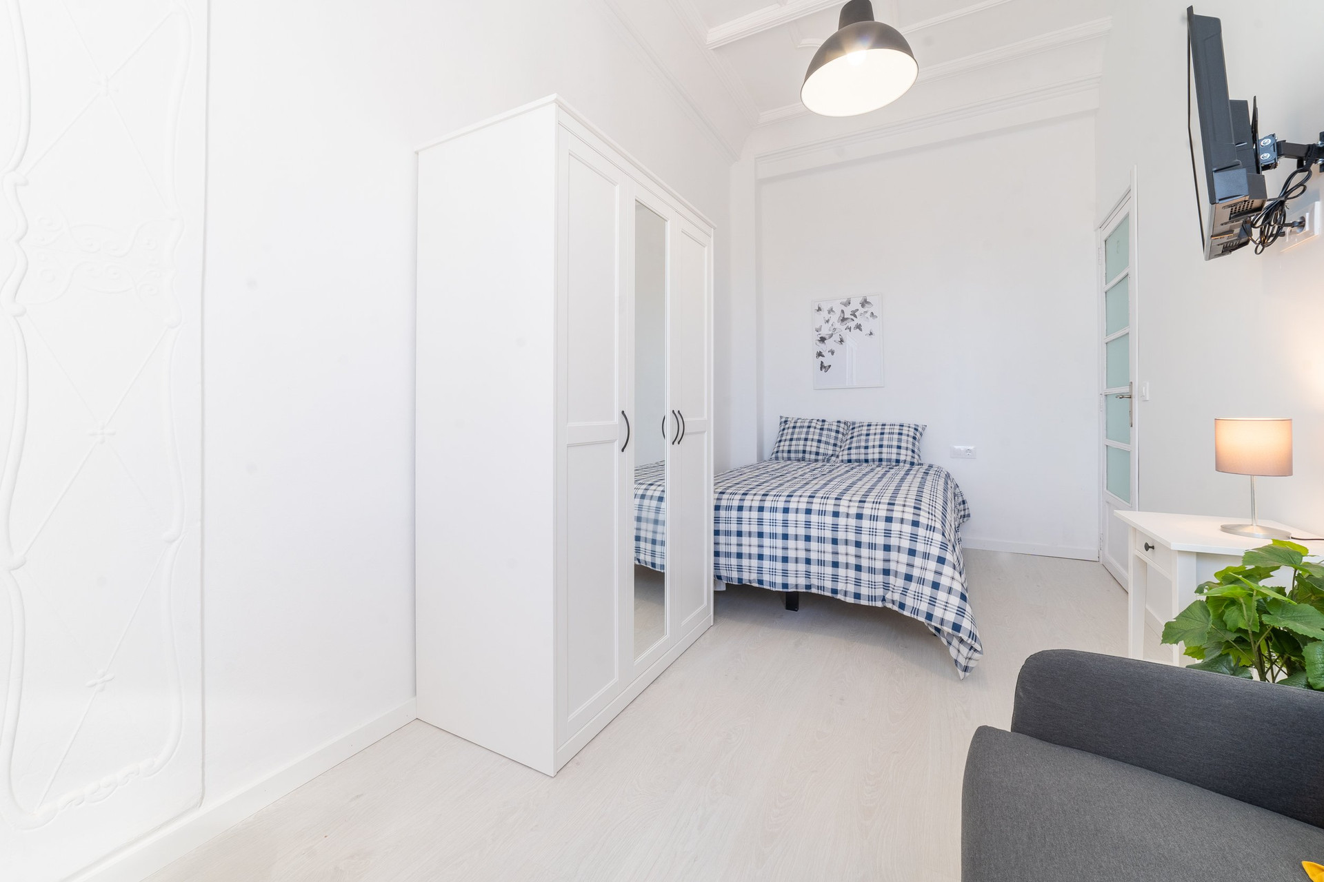 Bedroom with wardrobe and sofa