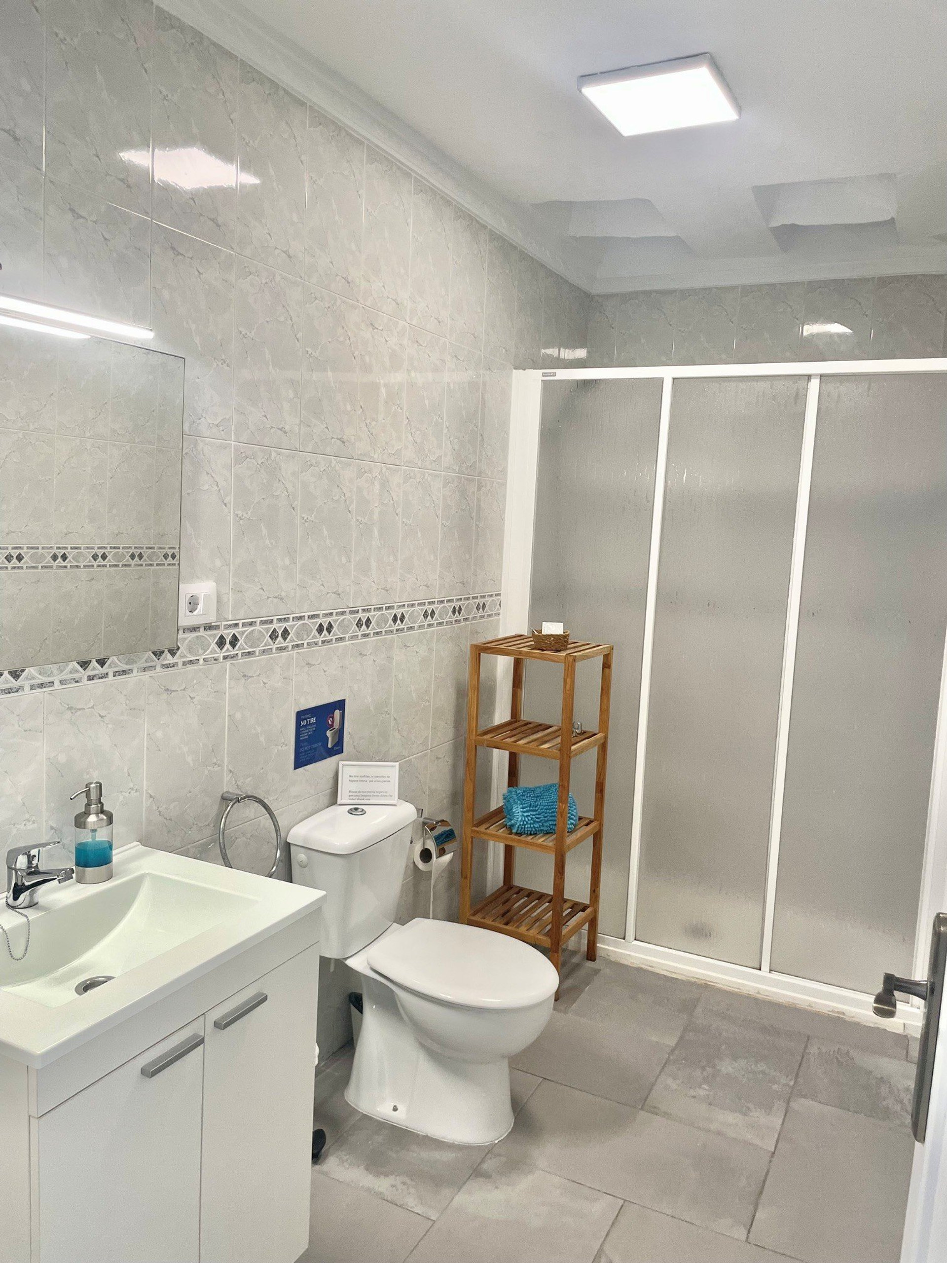 Bathroom with shower and vanity