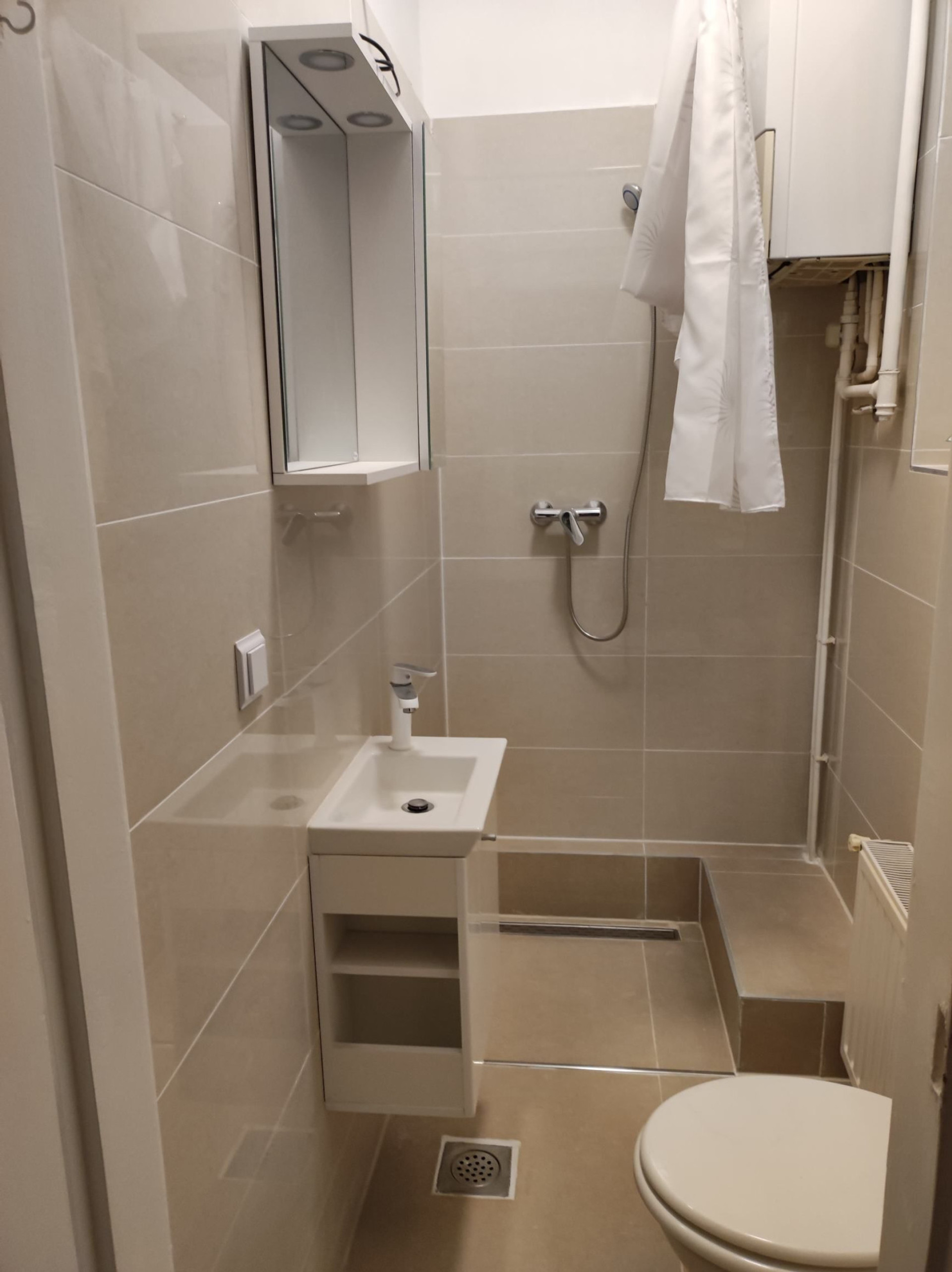 Full bathroom with toilet and shower