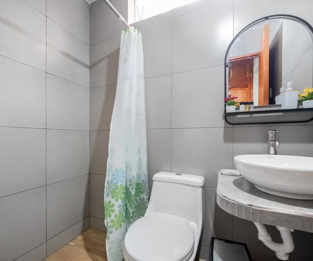 Bathroom with toilet and vanity sink