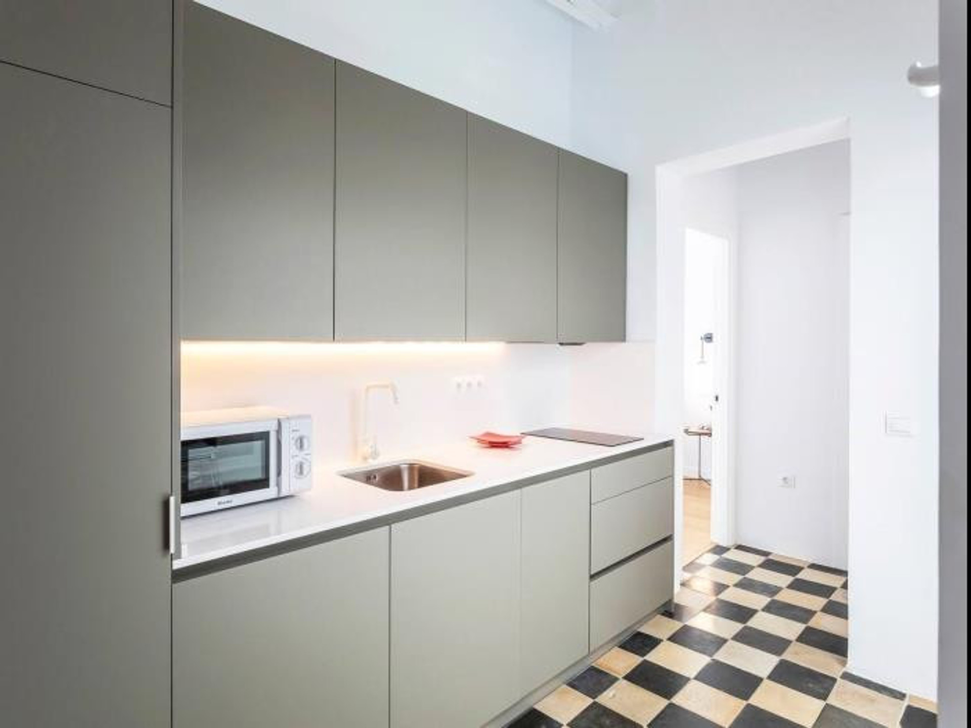 Modern kitchen with checkered floor