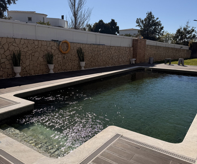 Outdoor swimming pool with sun deck
