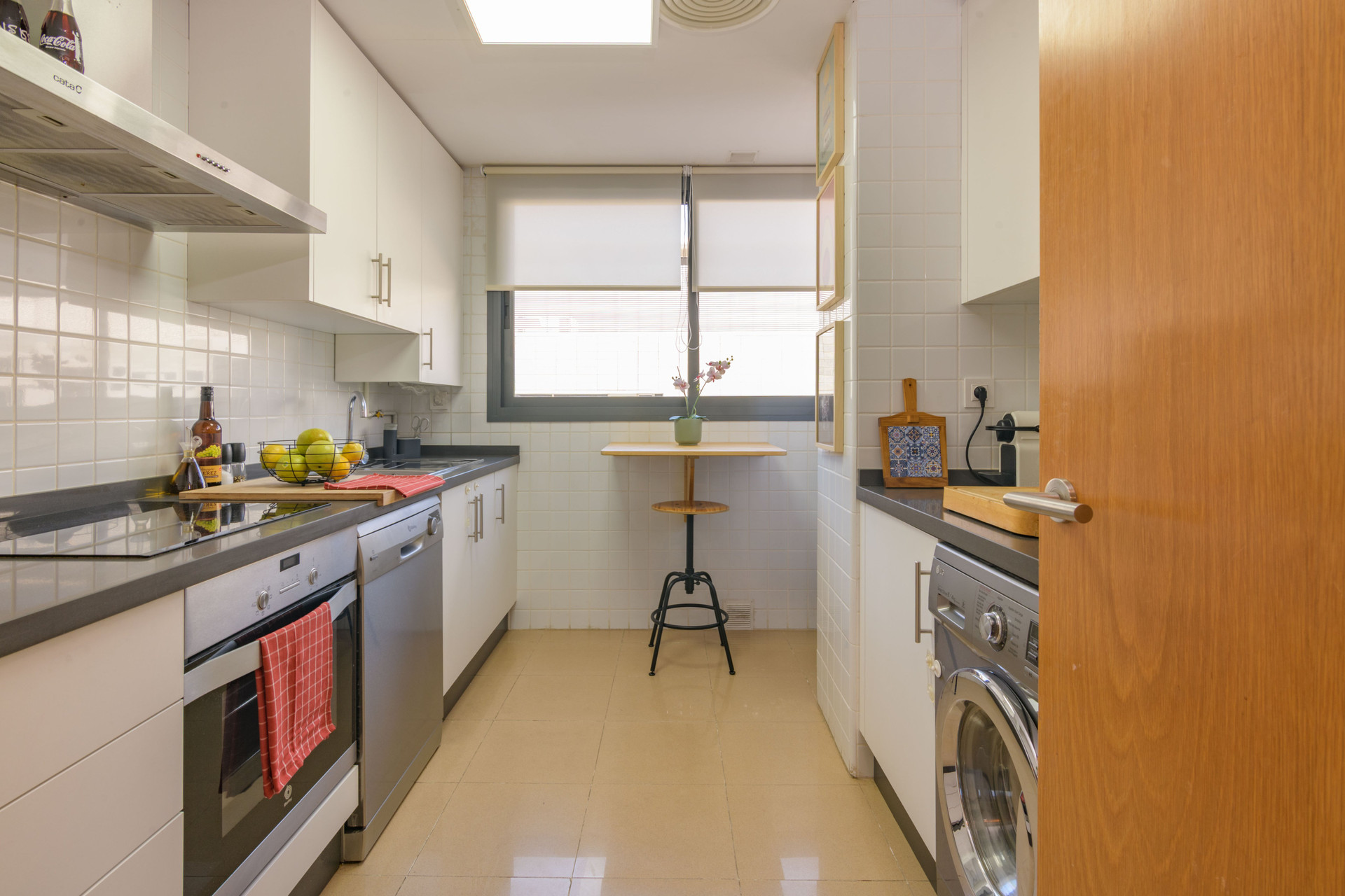 Galley kitchen with dining nook