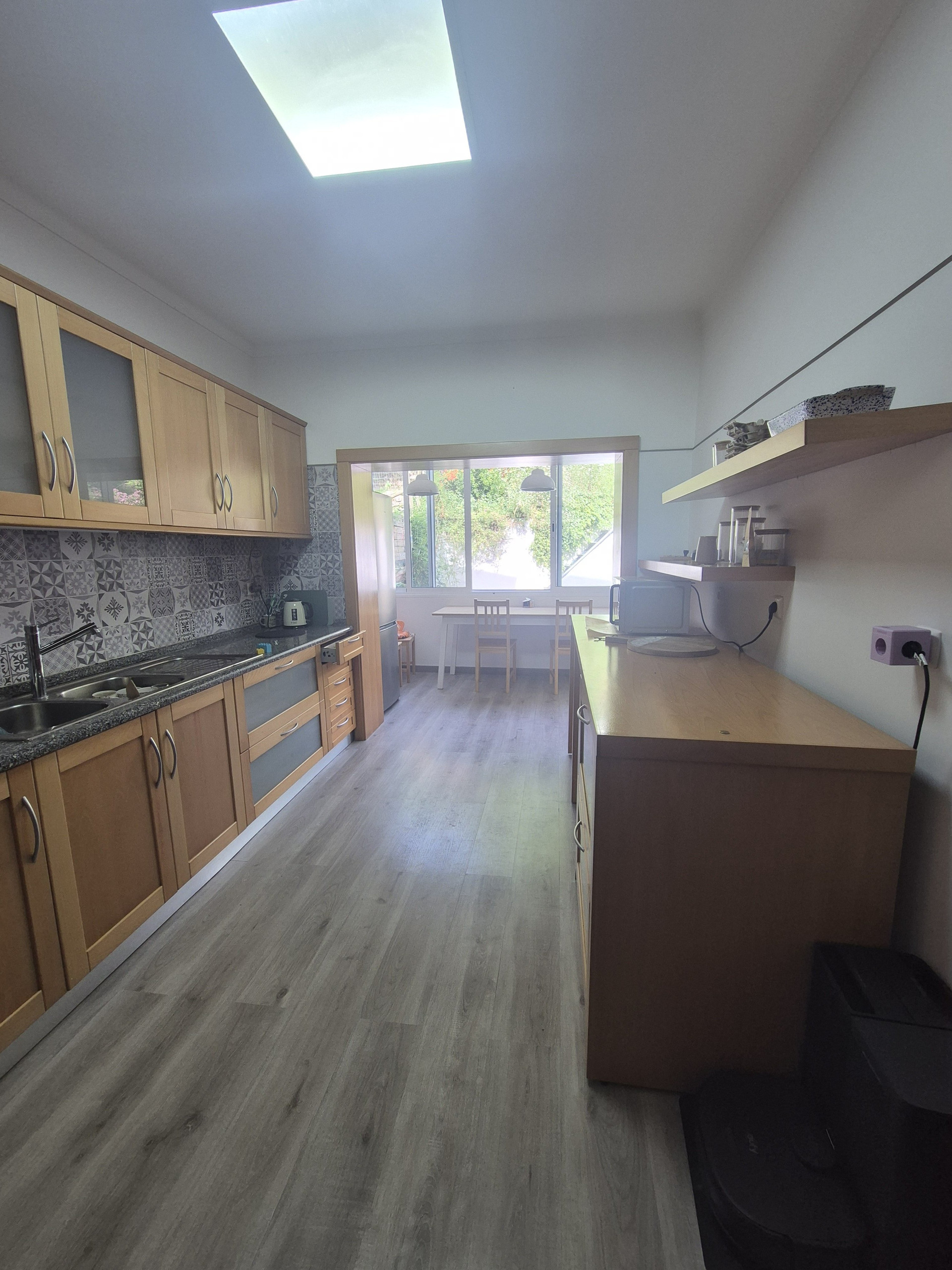 Kitchen with wood cabinets and tiles
