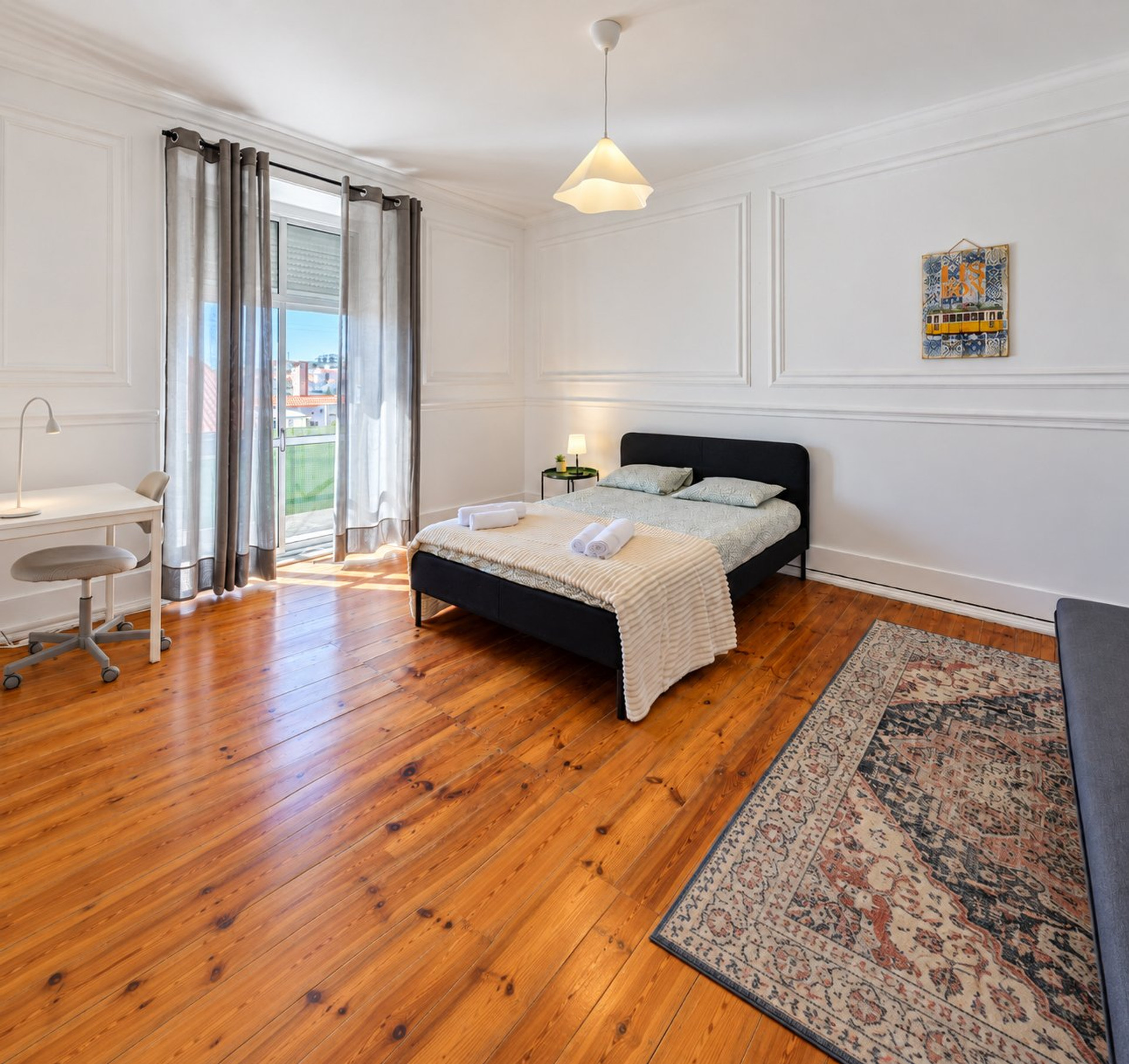 Spacious bedroom with hardwood floors