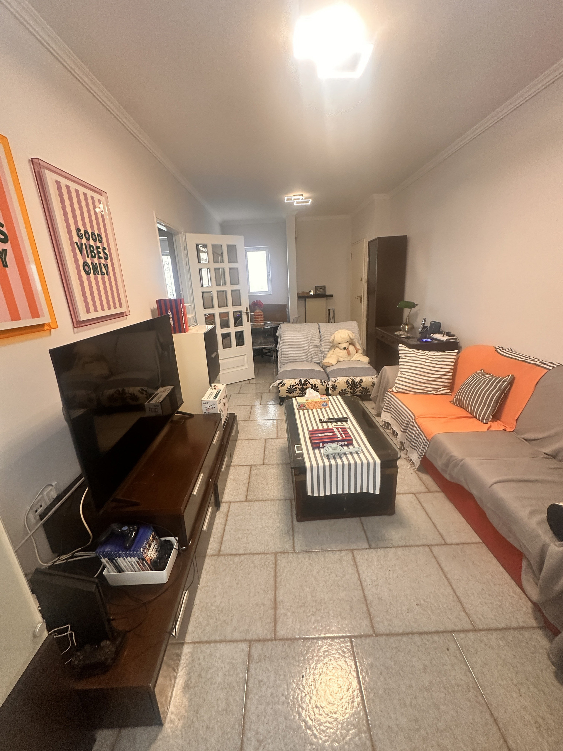 Living room with striped sofa
