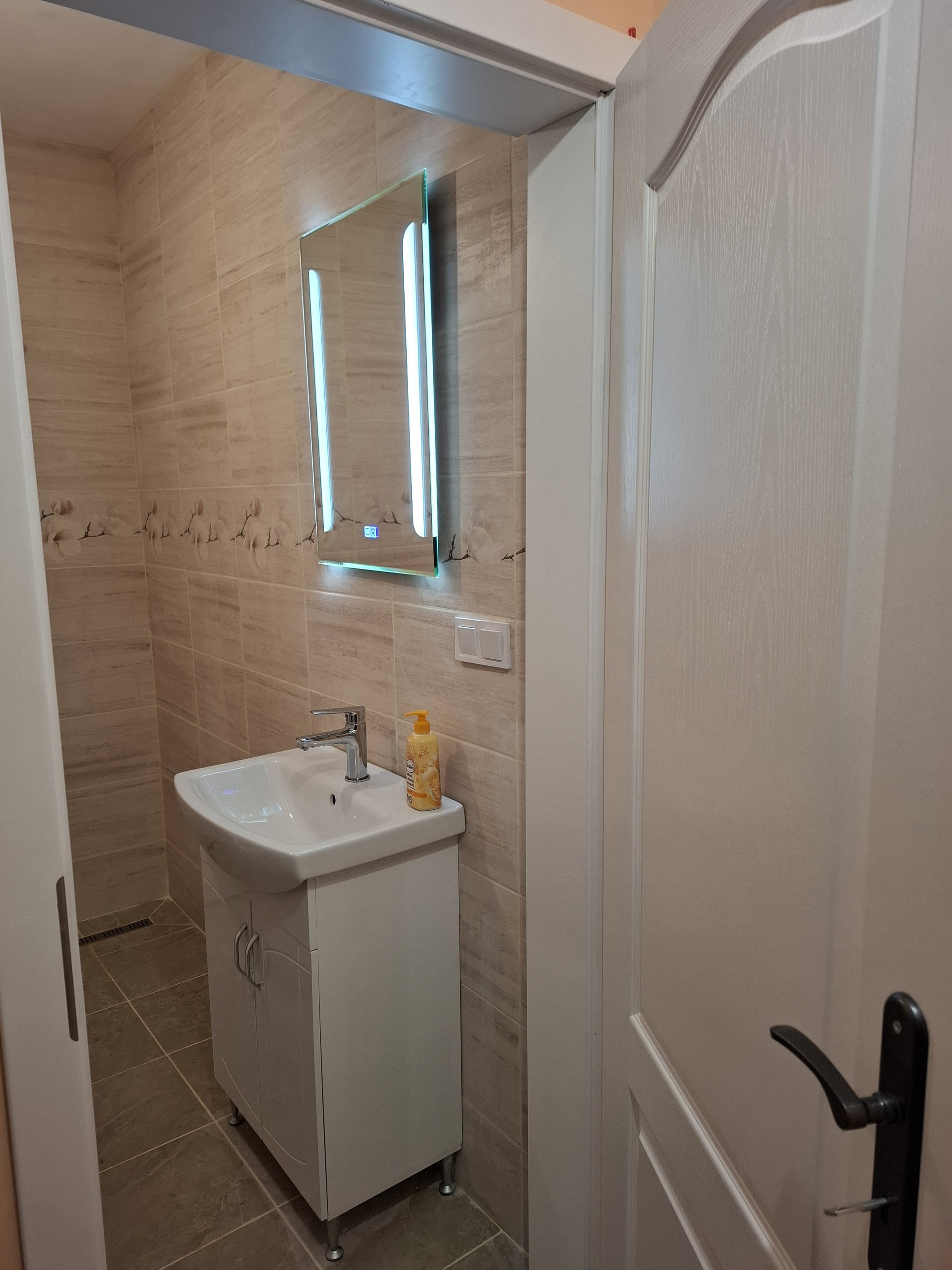 Bathroom sink with LED mirror