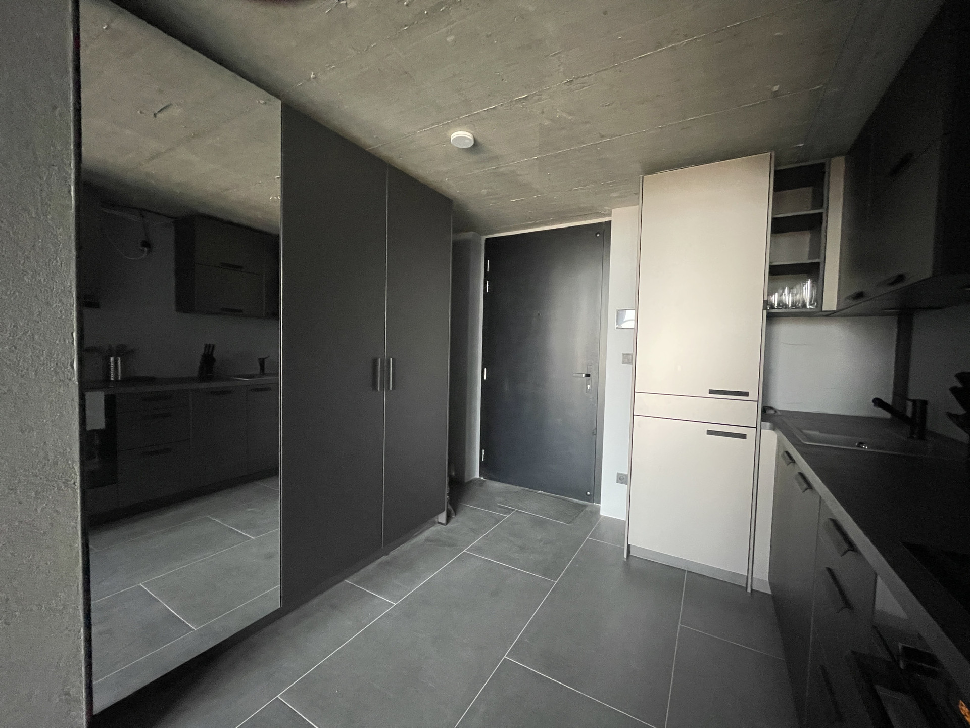 wardrobe area and kitchen