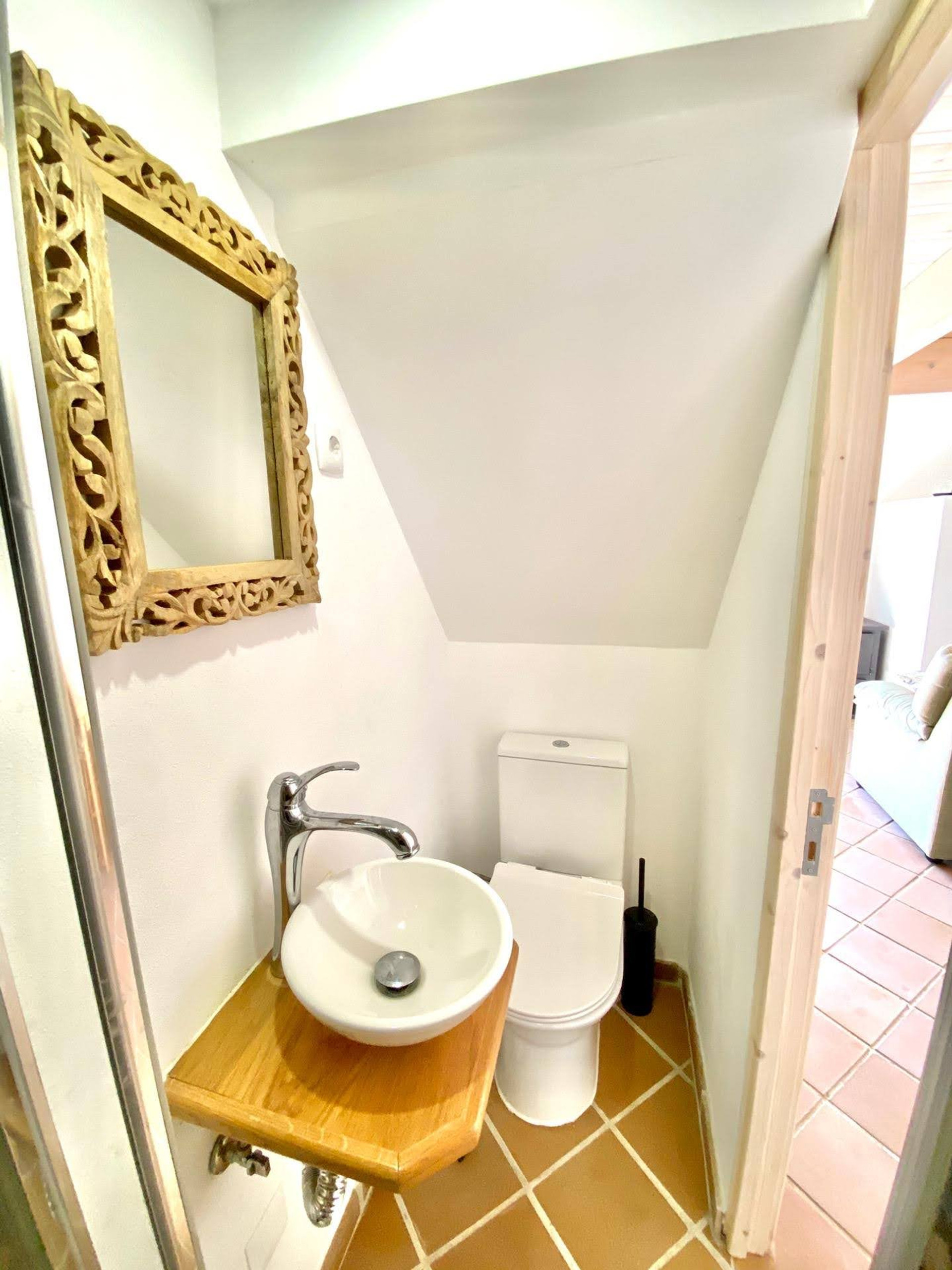 Small bathroom under stairs