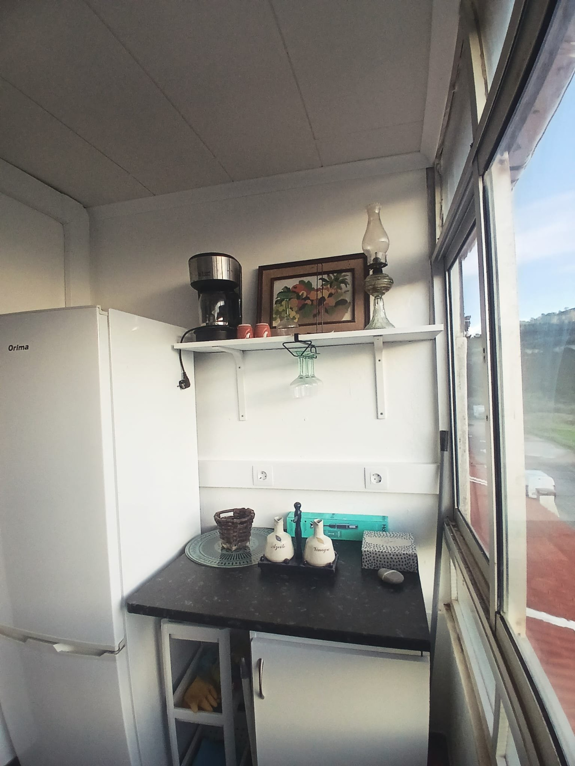 Kitchenette with fridge and counter