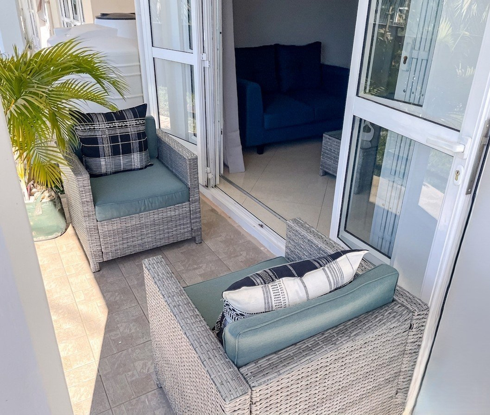 Balcony seating with palm plant