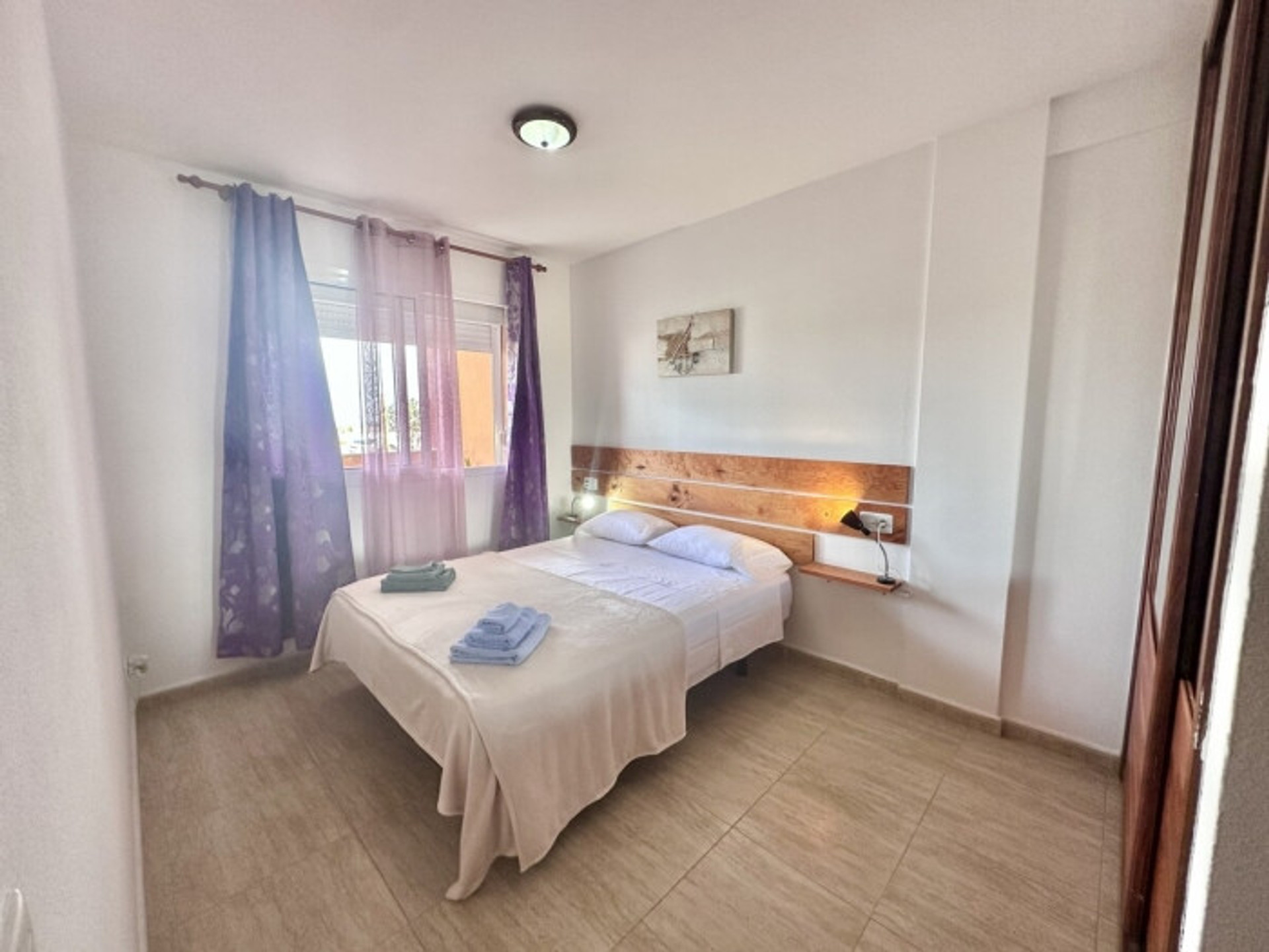 Bright bedroom with double bed