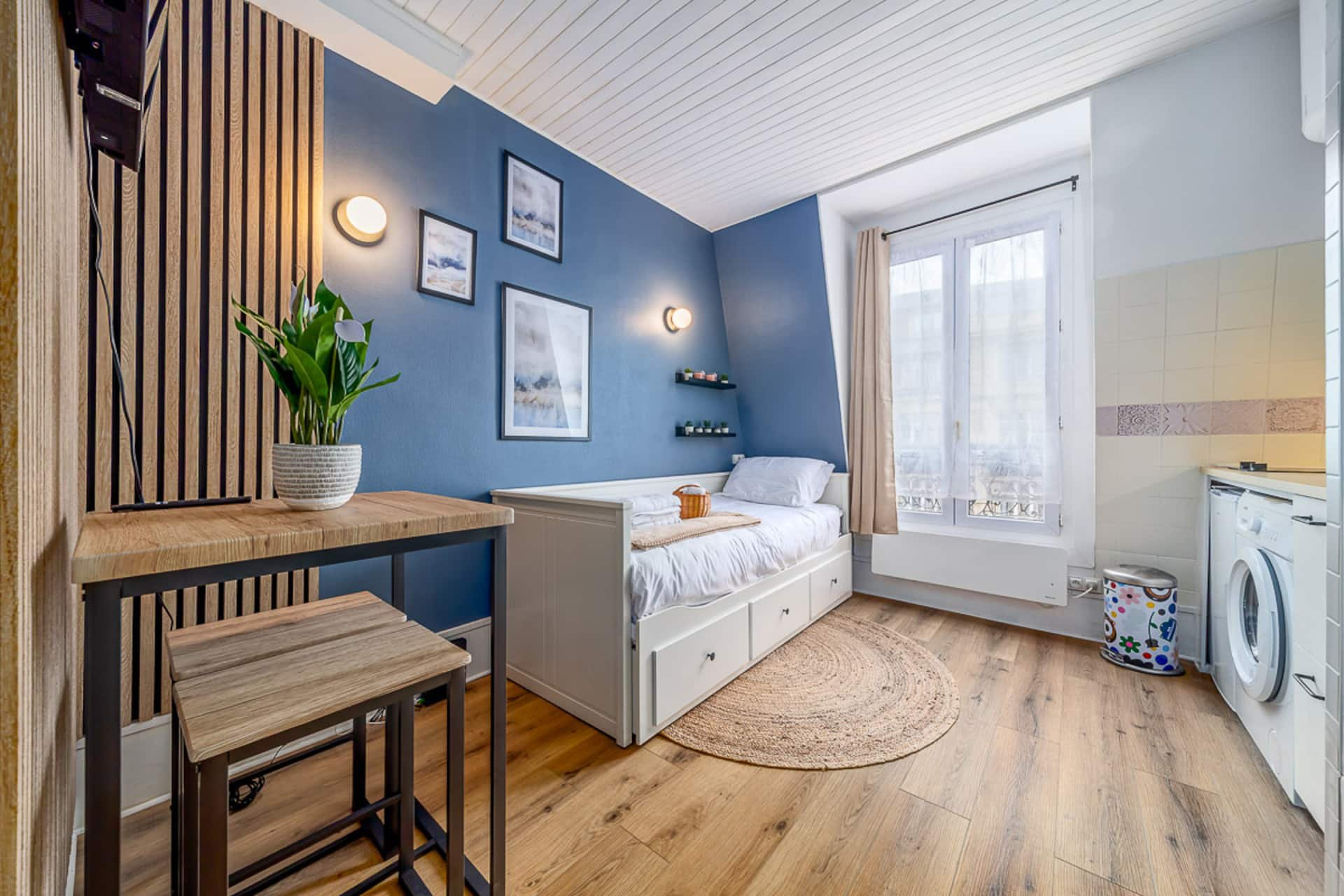 Cozy studio bed near window