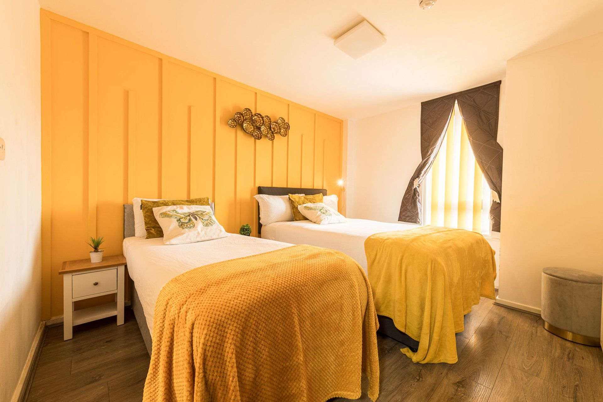 Twin bedroom with yellow wall