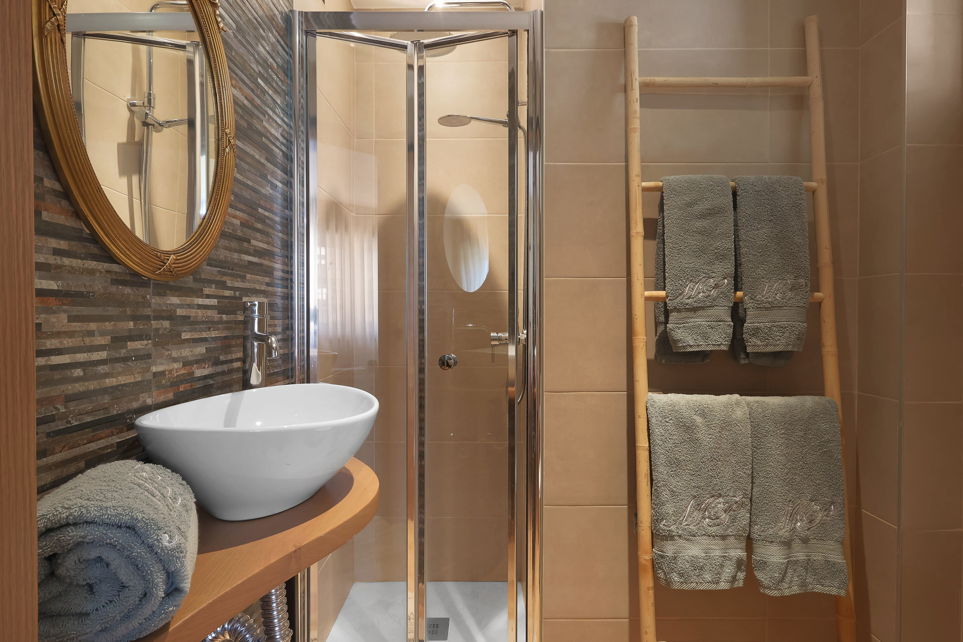 Bathroom with shower and vessel sink