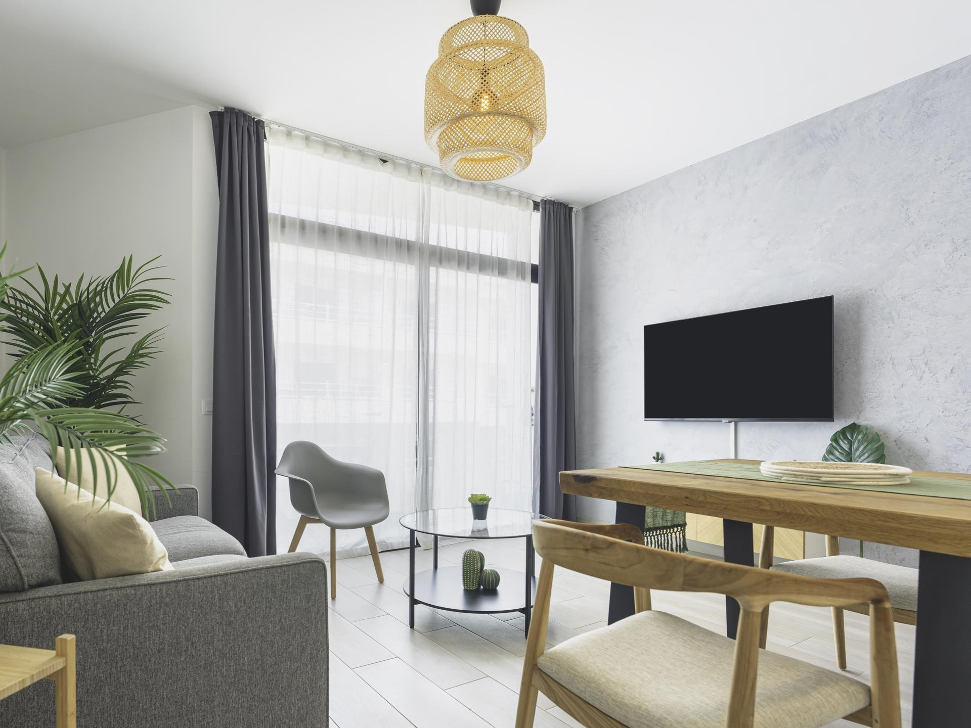 Living room with TV and balcony