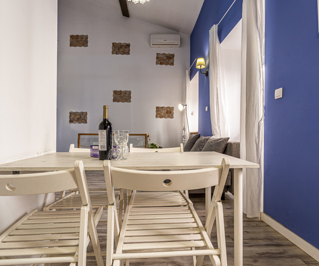 Dining table with blue walls