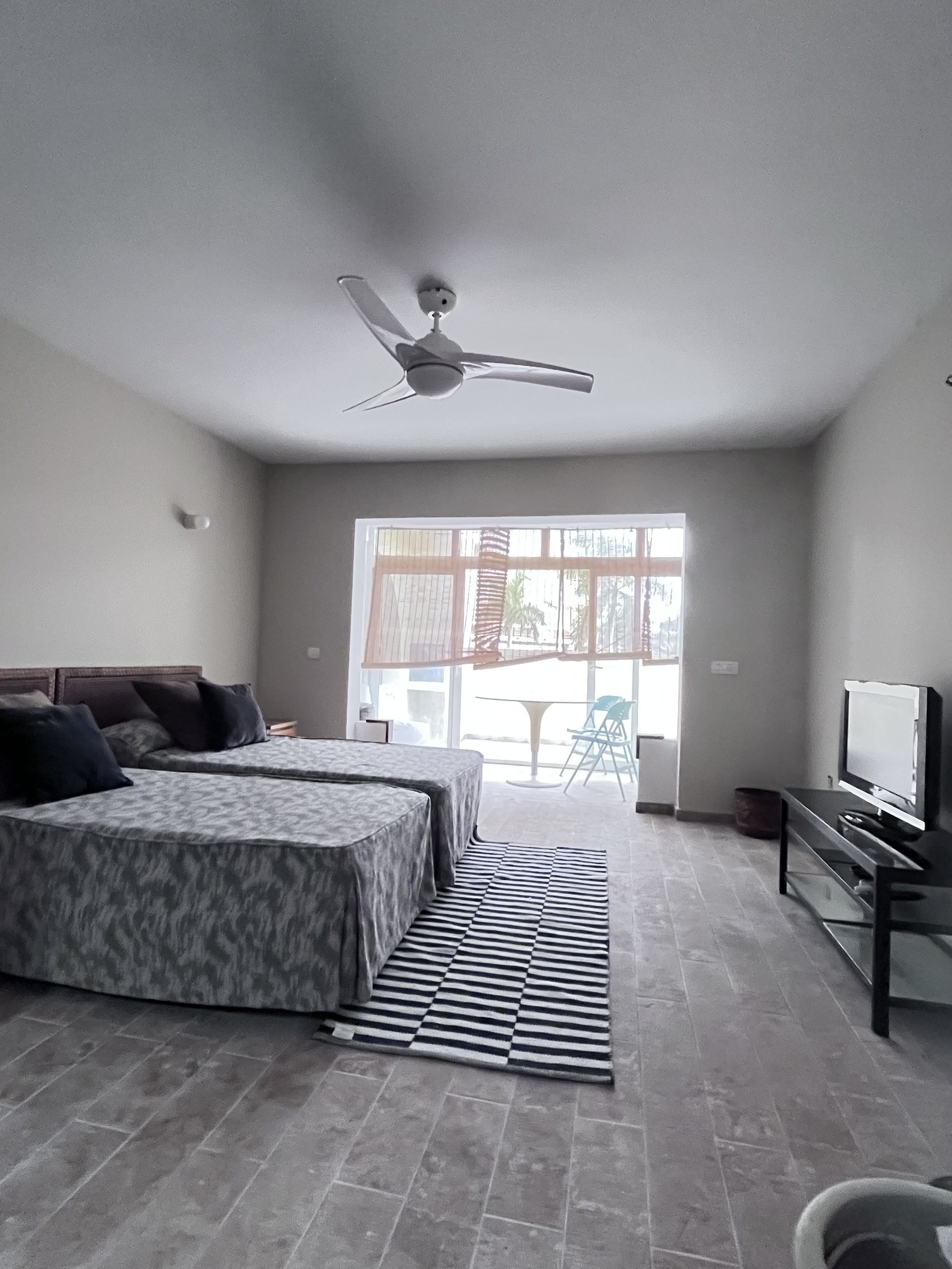 Bedroom with ceiling fan and window