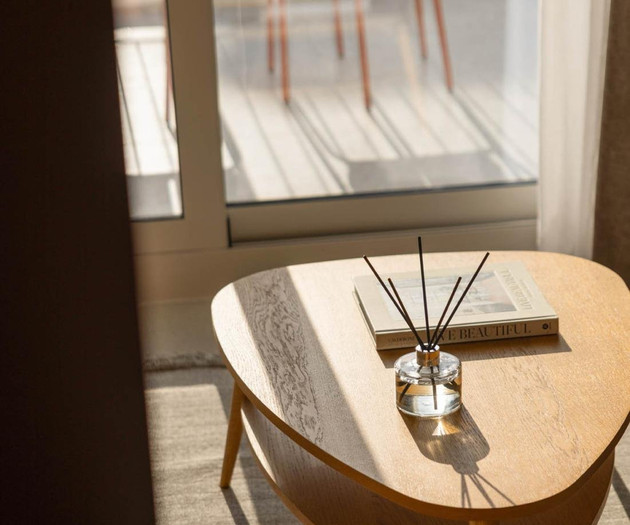 Wooden coffee table by window