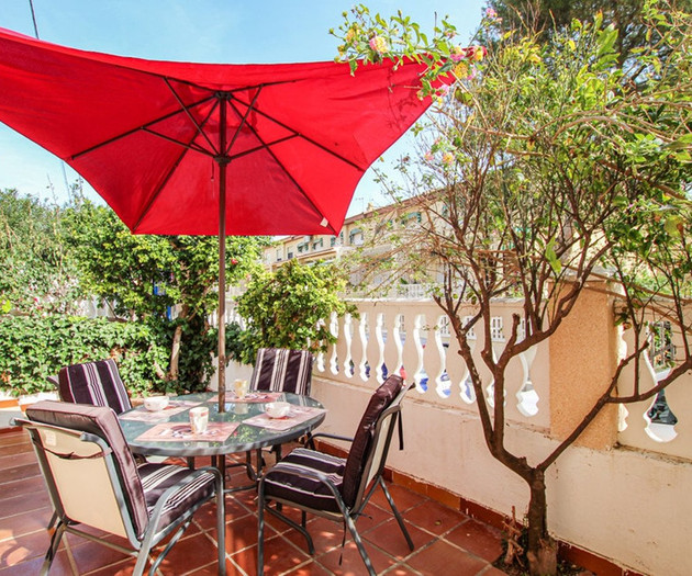 Terrace with red umbrella
