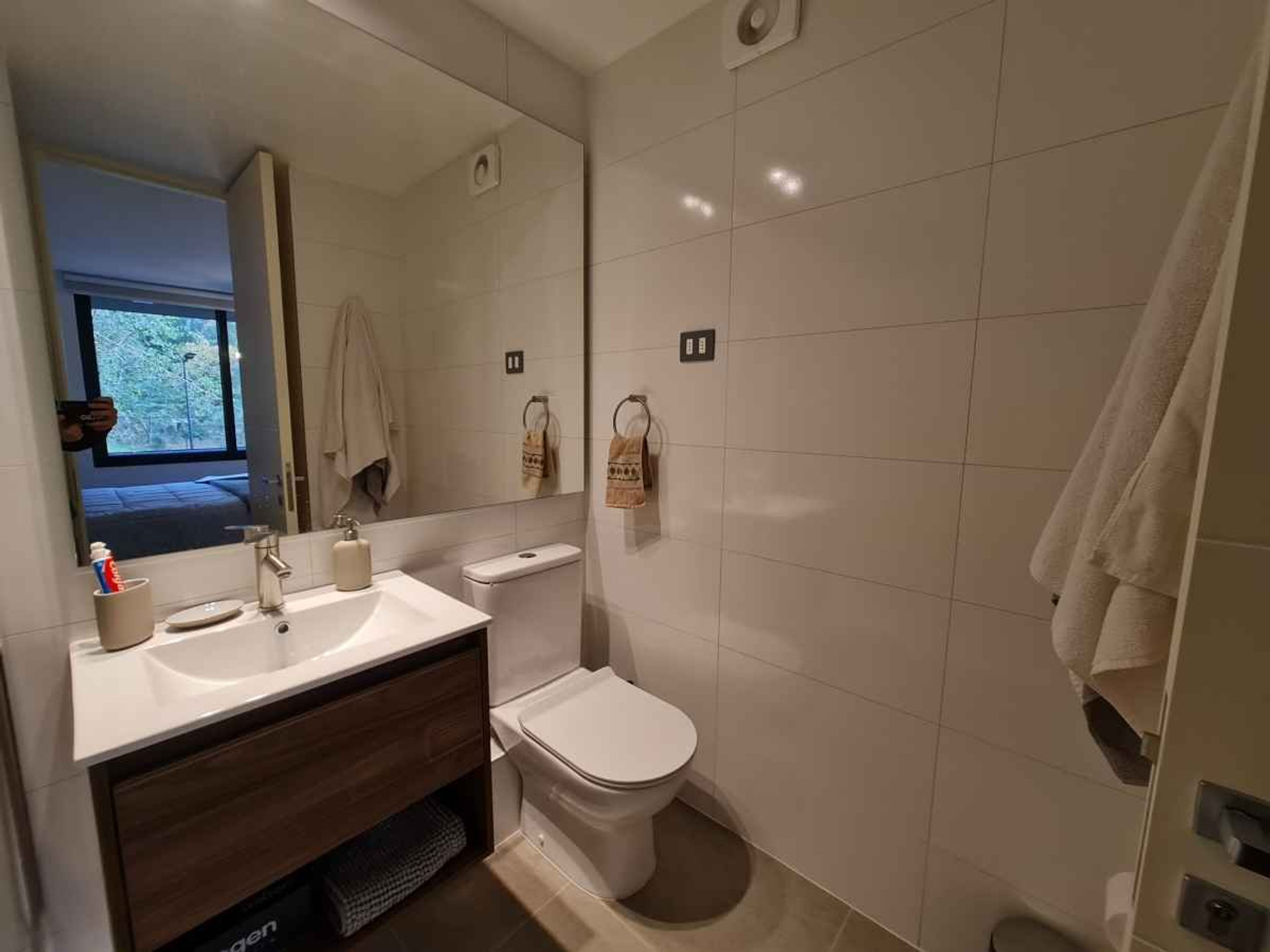 Modern, clean bathroom with hotel-style comfort. Spacious shower, quality finishes, and everything you need for long stays.