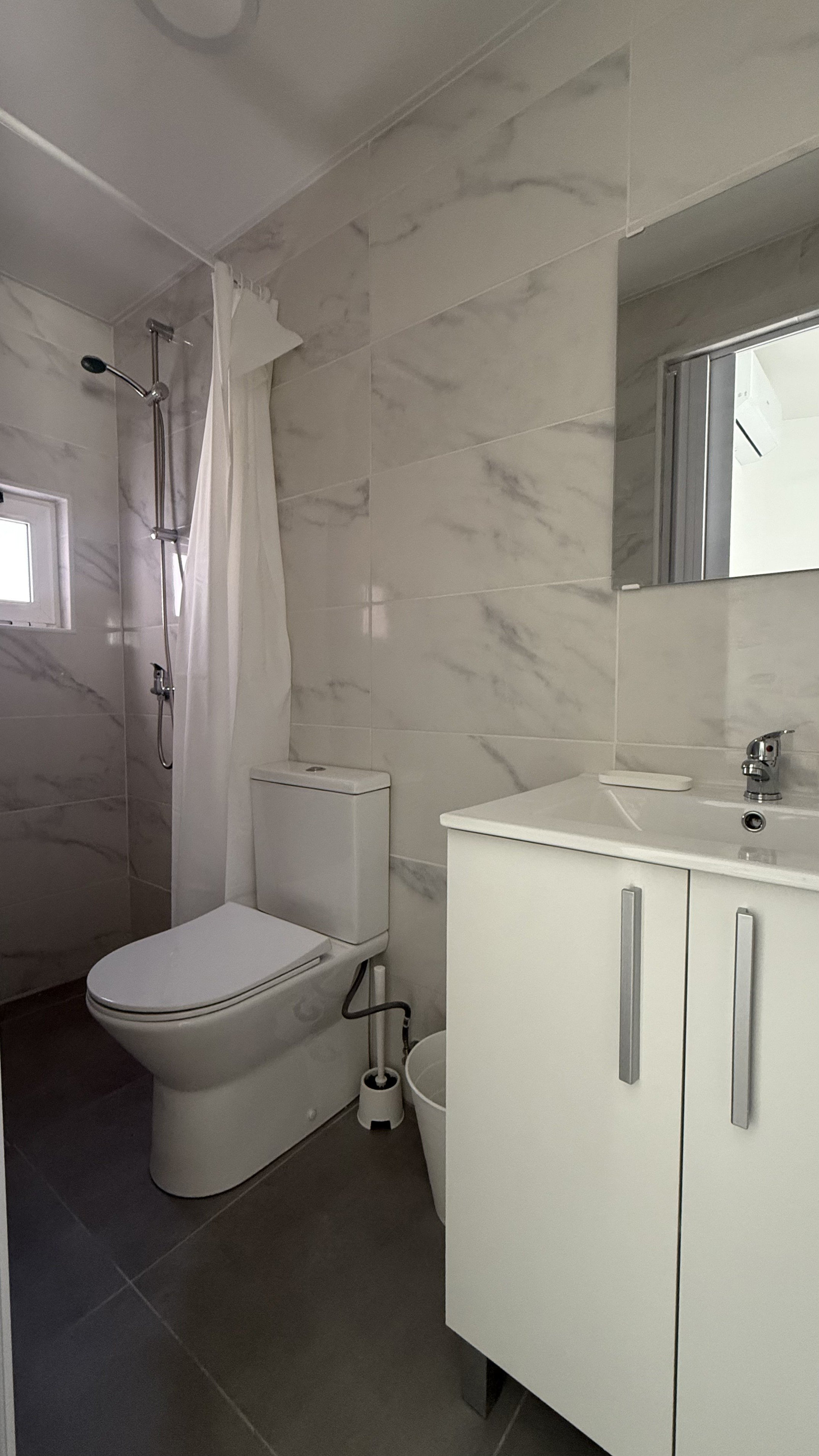 Bathroom with shower and vanity