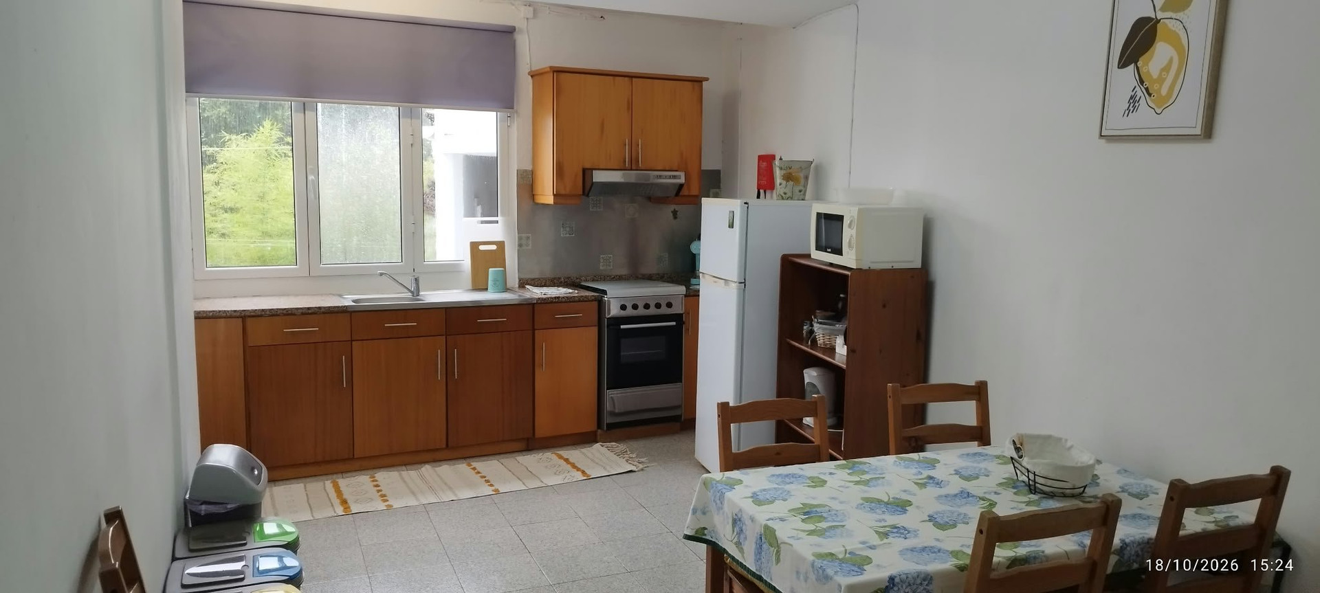 Kitchen with wooden cabinets and dining