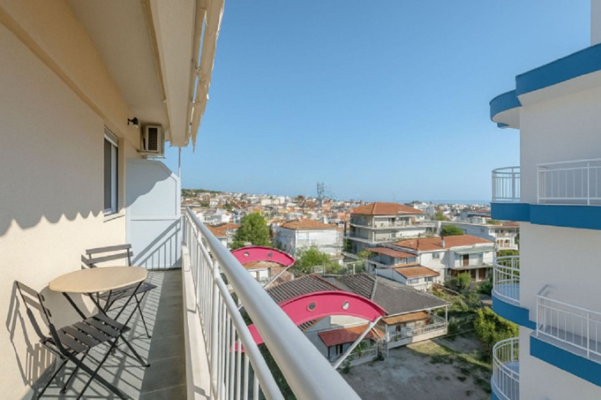 Spacious private balcony with a dining setup – the perfect spot for your morning coffee or alfresco dinners