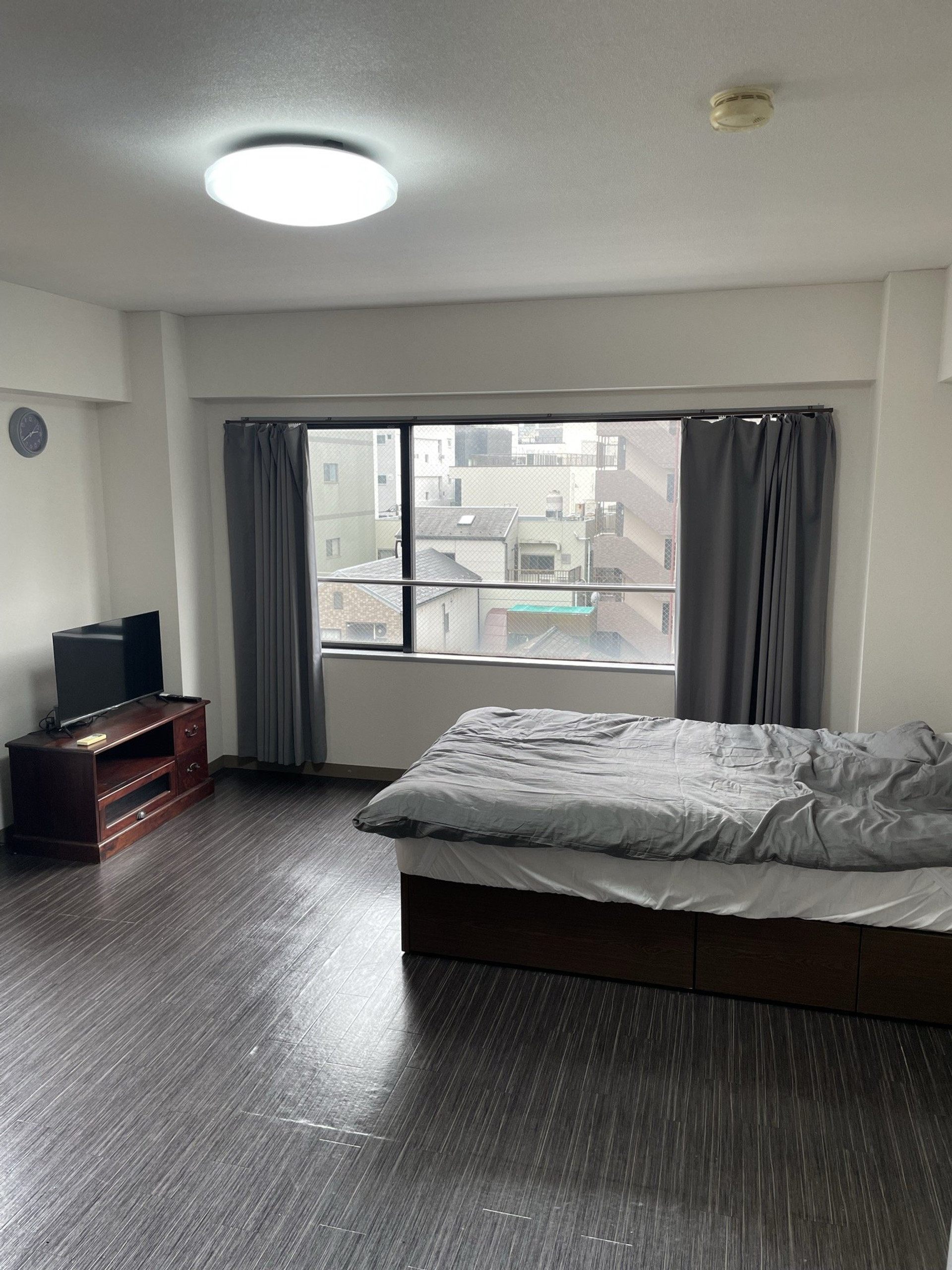 Bedroom with double bed and TV