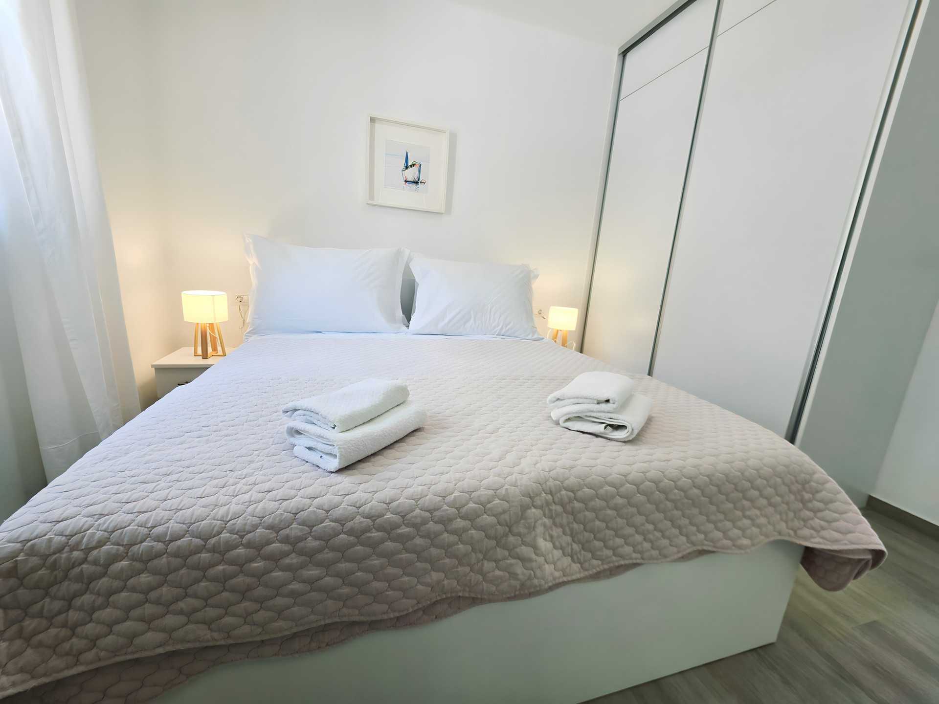 Bedroom with bed and towels