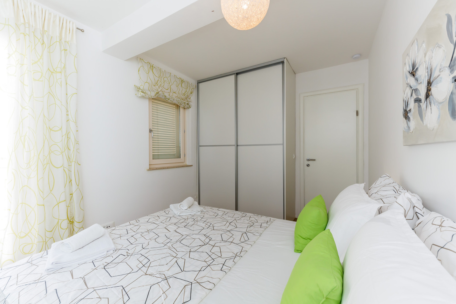 bedroom with balcony and beach view