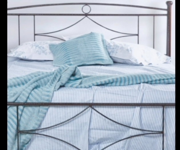 Bedroom bed with blue linens