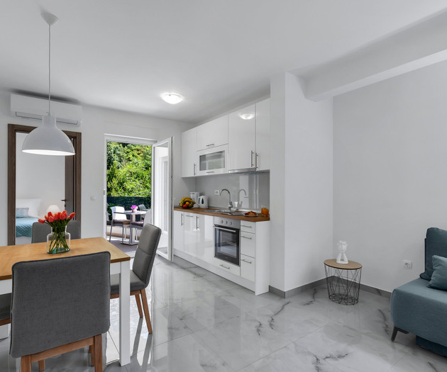 Living area with kitchen and dining