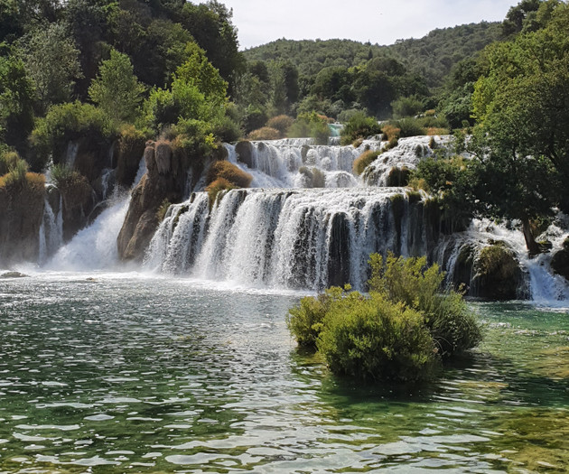 Waterfall cascading into pool