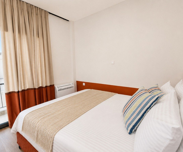 Bedroom with balcony view