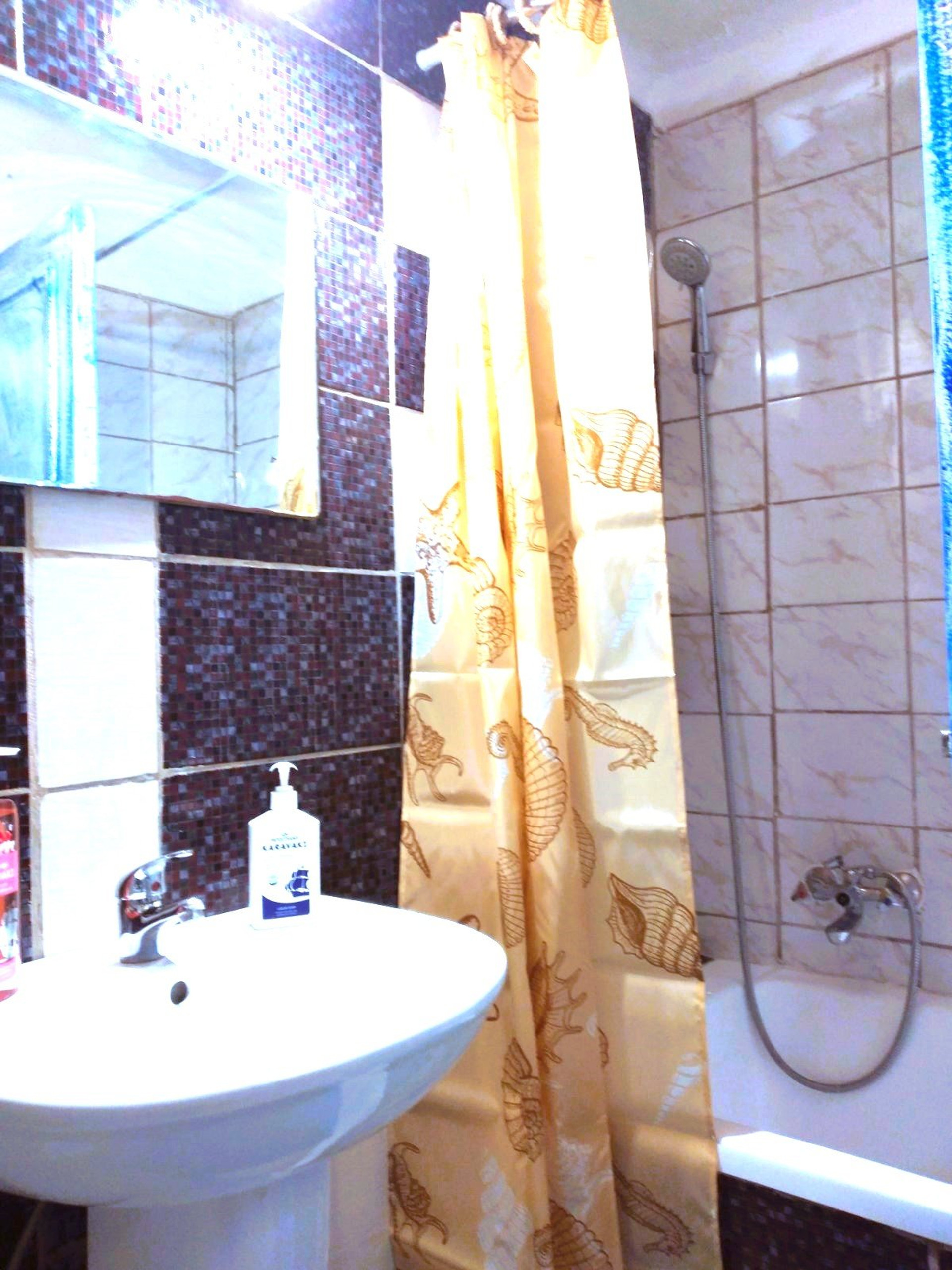 Bathroom with sink and bathtub