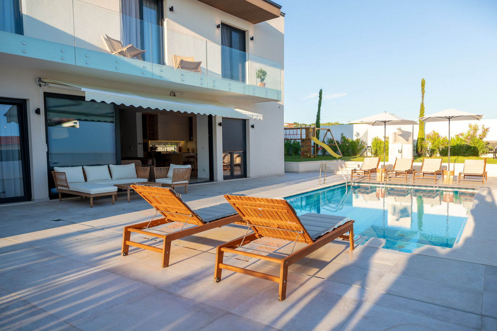 Pool terrace with villa facade