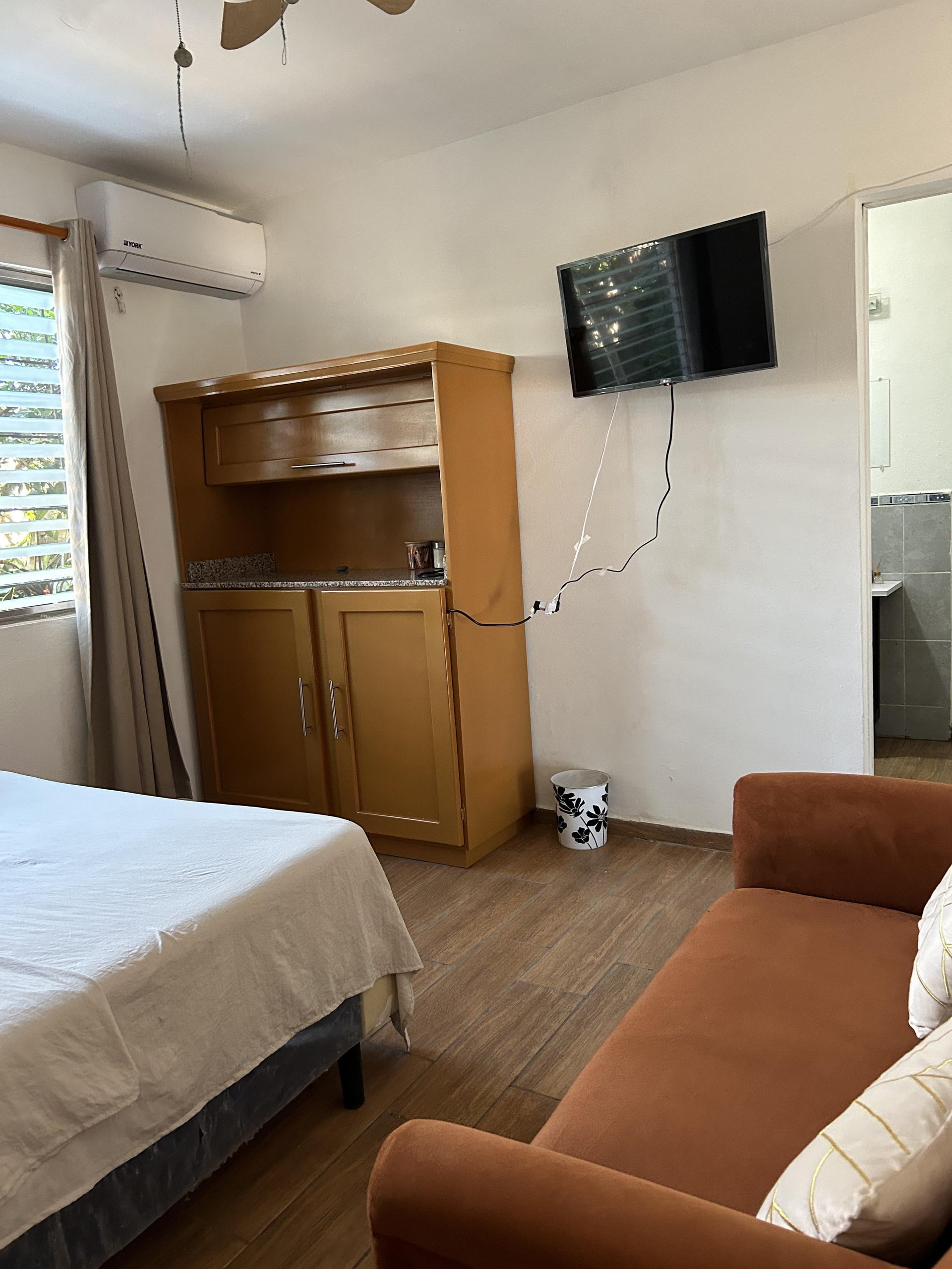 Bedroom with TV and AC unit