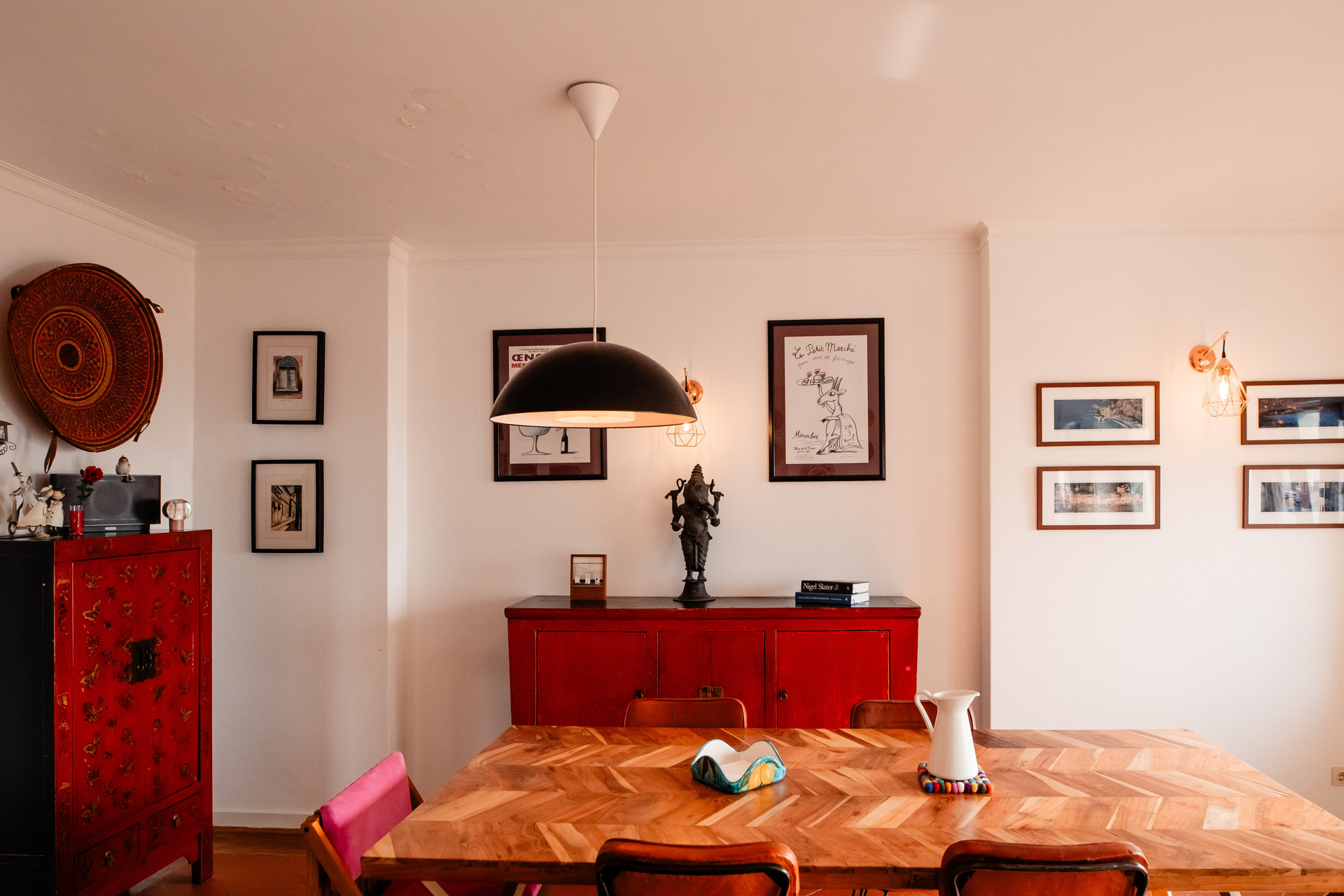 Dining area with red sideboard