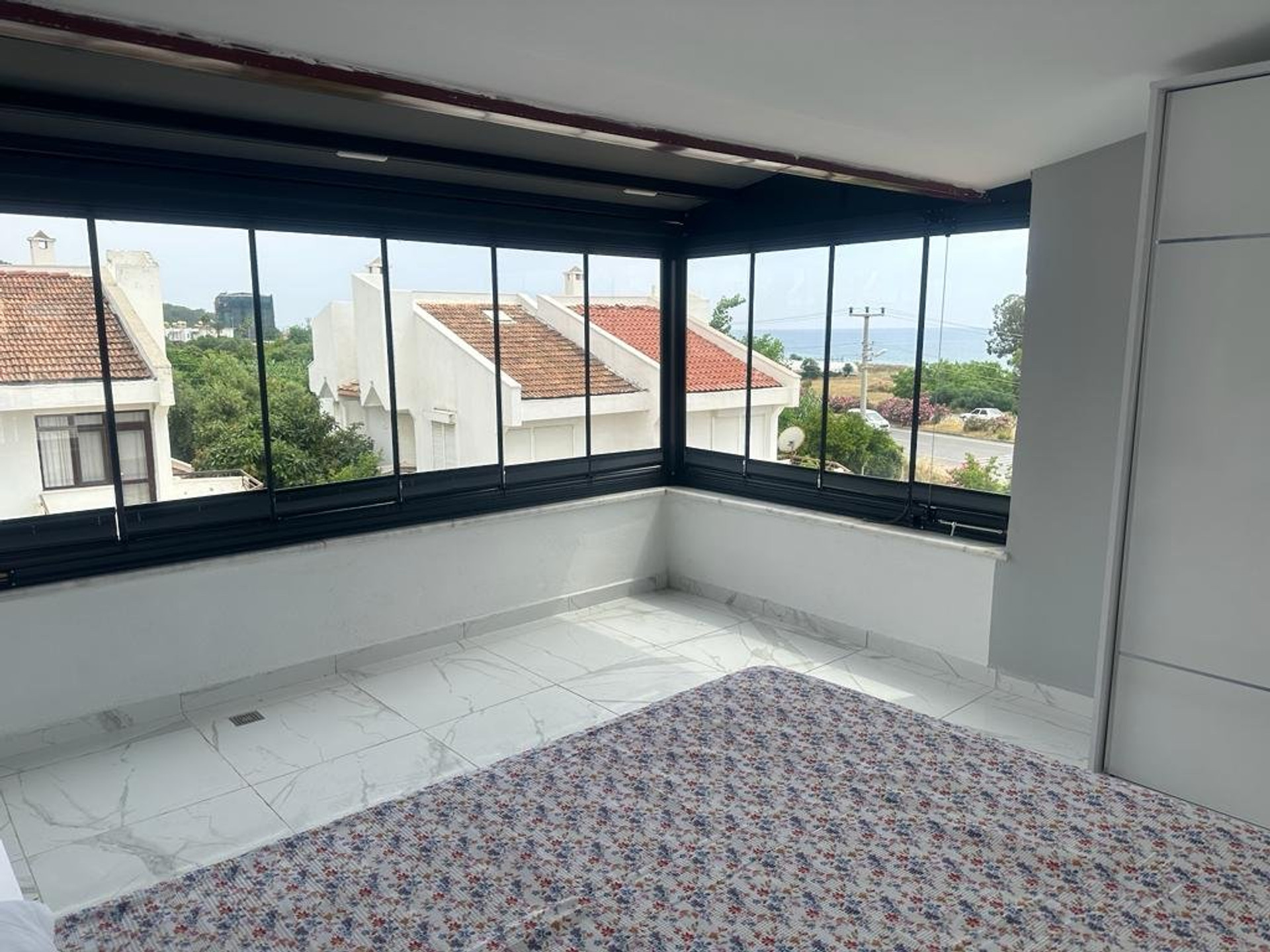 Bedroom with enclosed balcony sea view