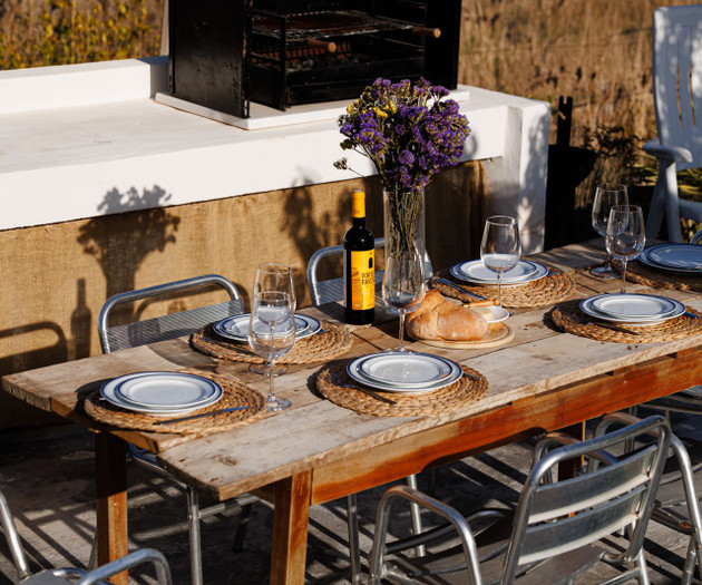Outdoor dining table with barbecue