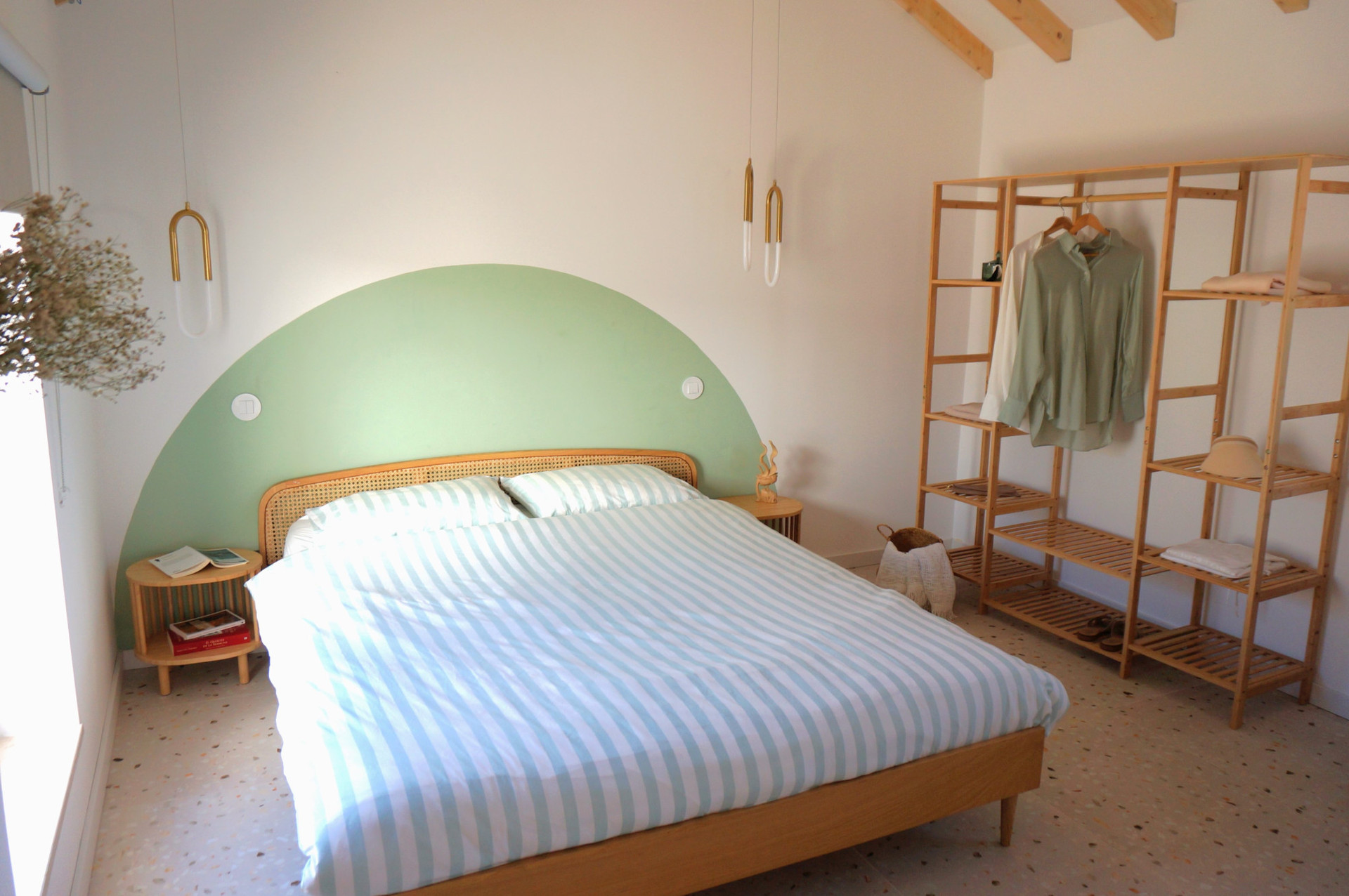 Bedroom with green headboard