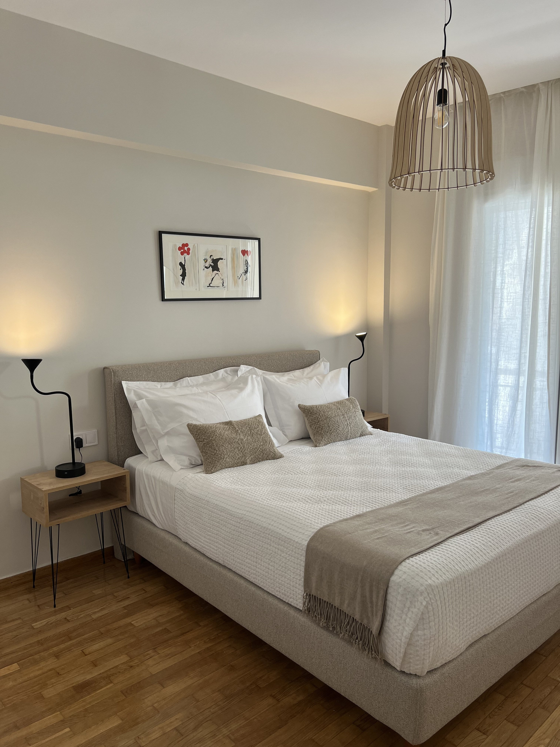 Bedroom with bed and wooden floor