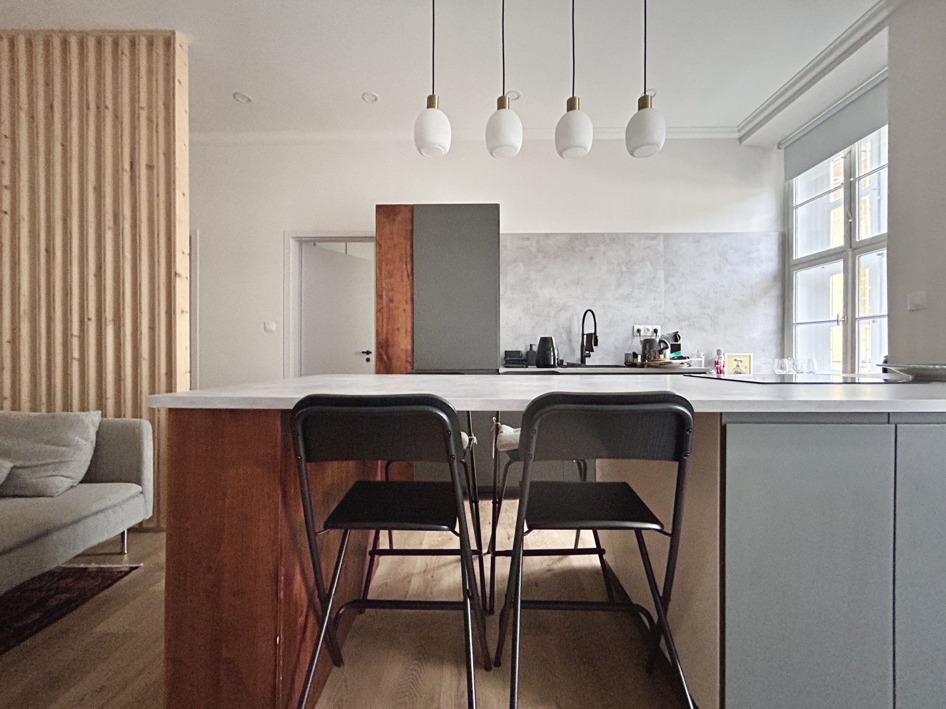 Dining table coupled with a kitchen island