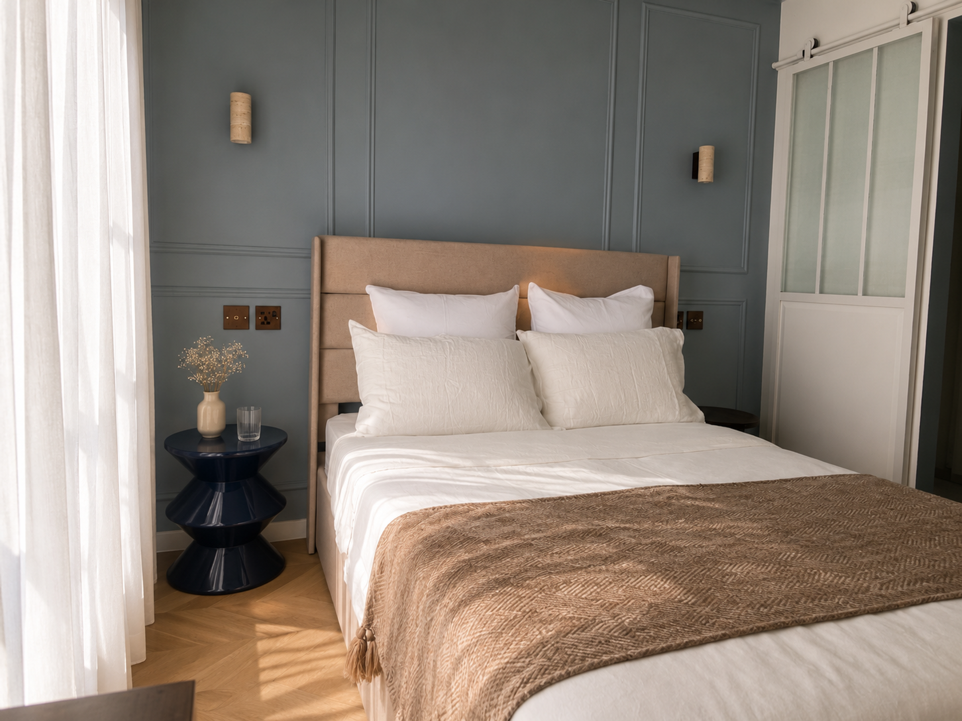 Bedroom with blue paneled wall