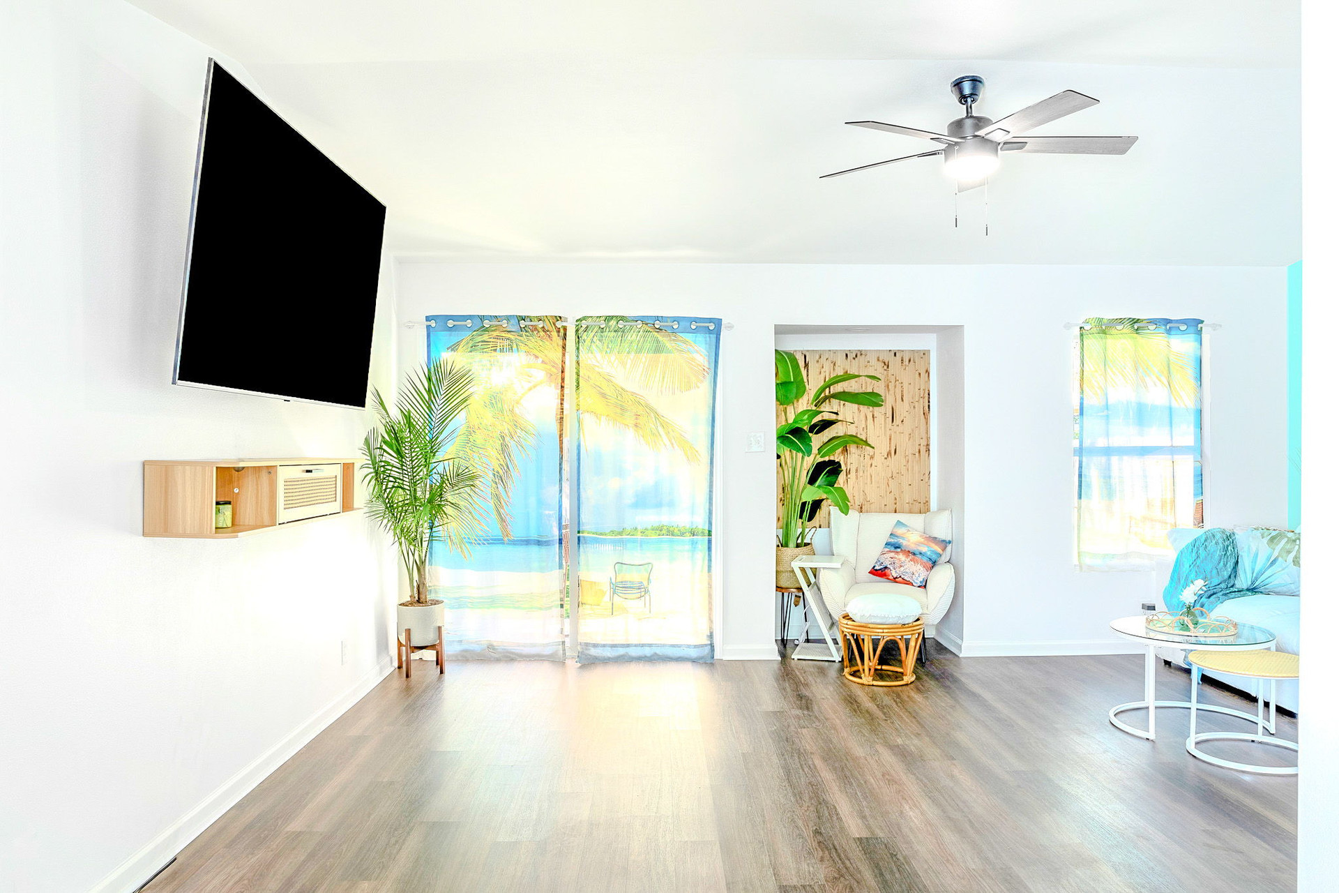 Living Room w/Large Smart TV and Backyard Access